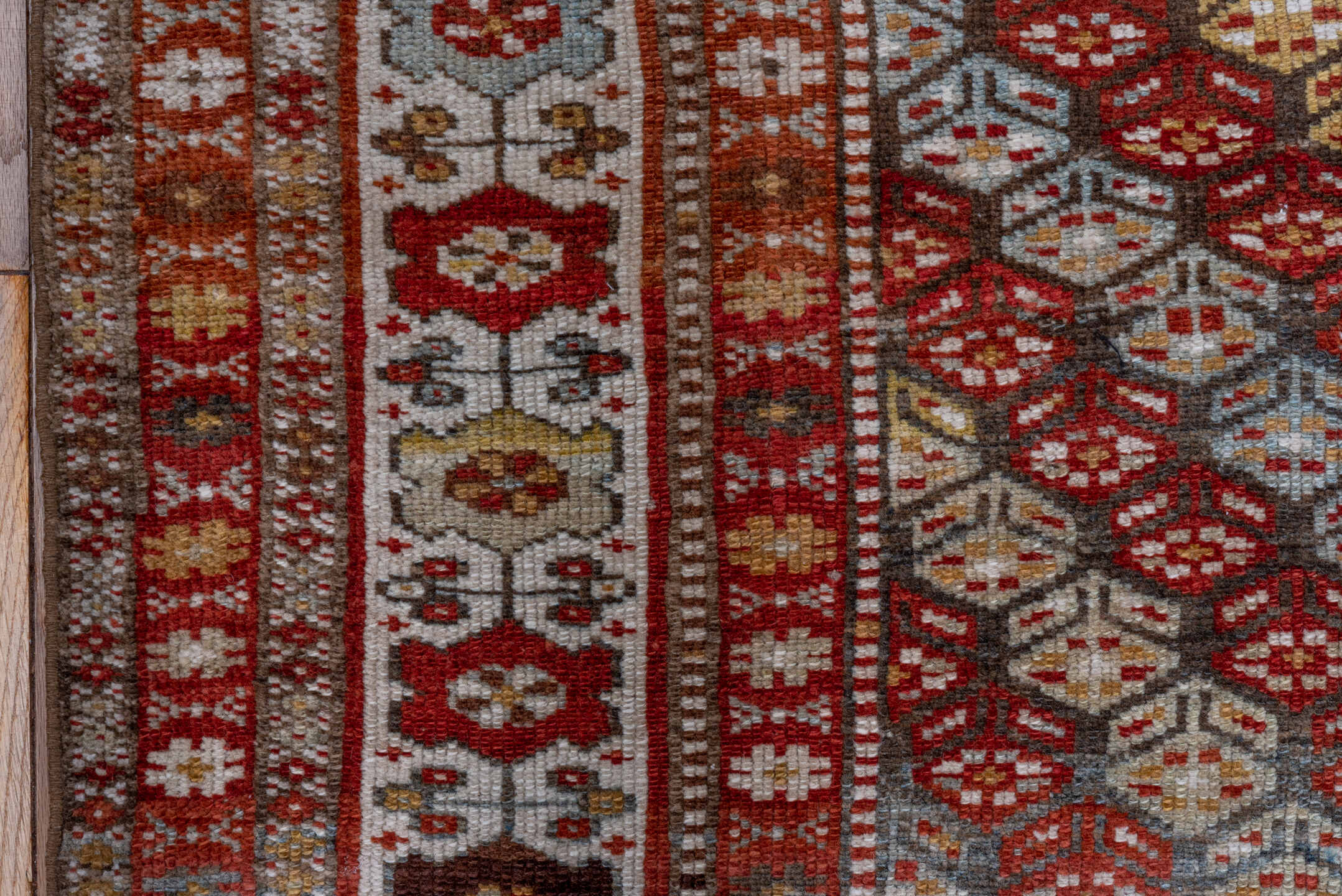 3' x 7' one-of-a-kind handmade antique Kurd rug. Color palette: rust, ivory, sky blue, camel, olive, brown, brick, slate