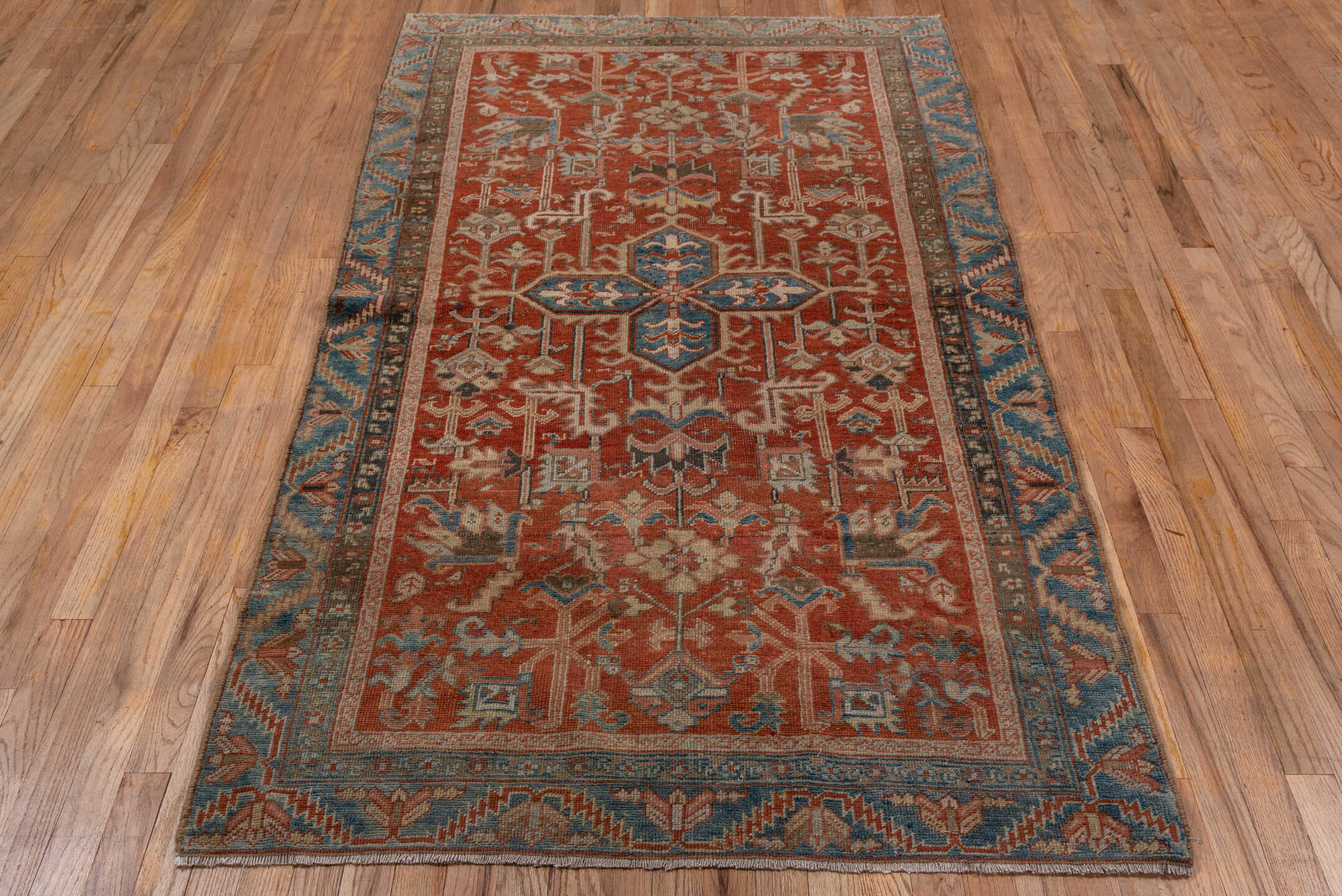 3' x 7' one-of-a-kind handmade antique Heriz rug. Color palette: rust, sky blue, ivory, taupe, slate, camel, charcoal