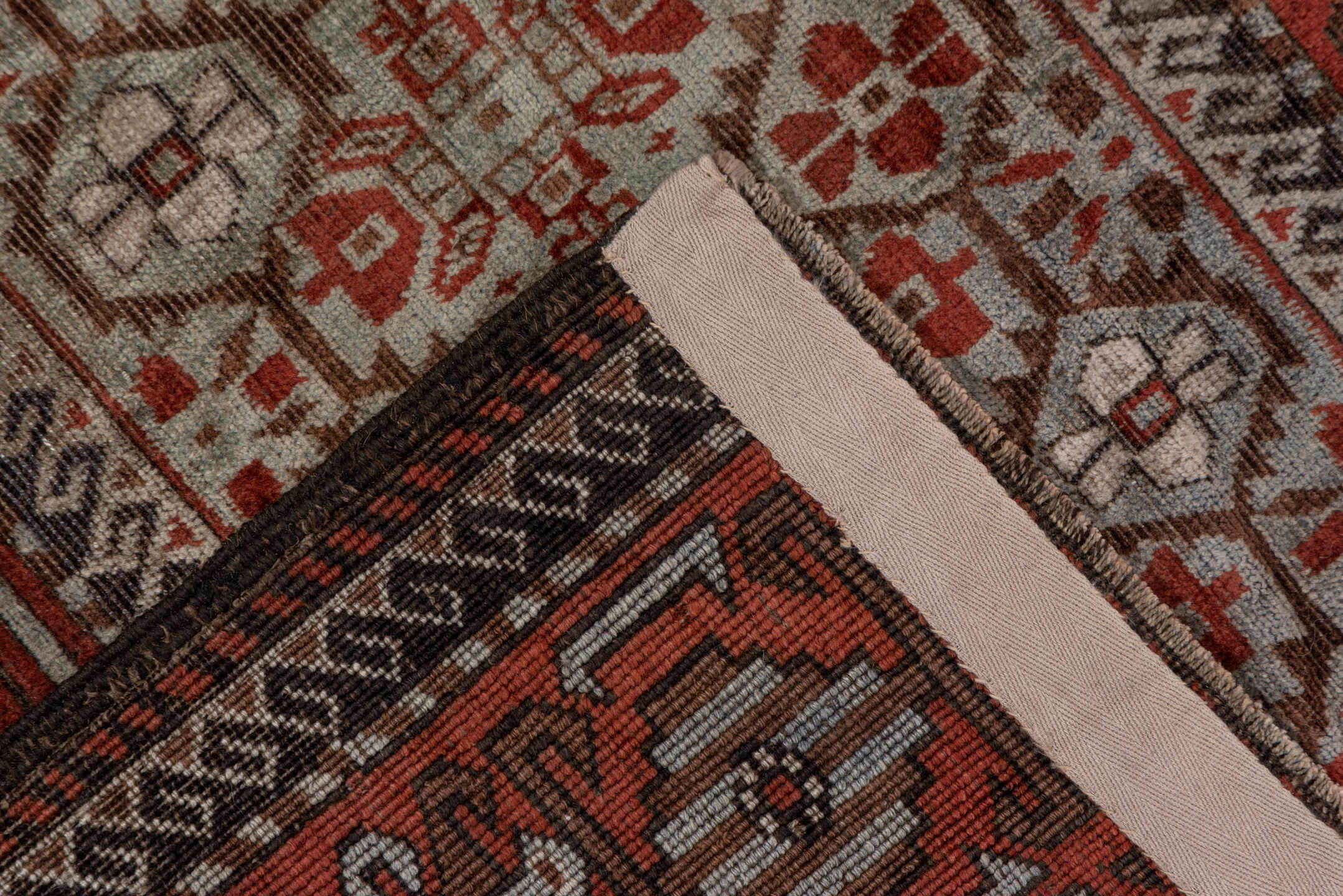 2' x 5' one-of-a-kind handmade antique Belouch small size rug. Color palette: rust, ivory, brown, camel, charcoal