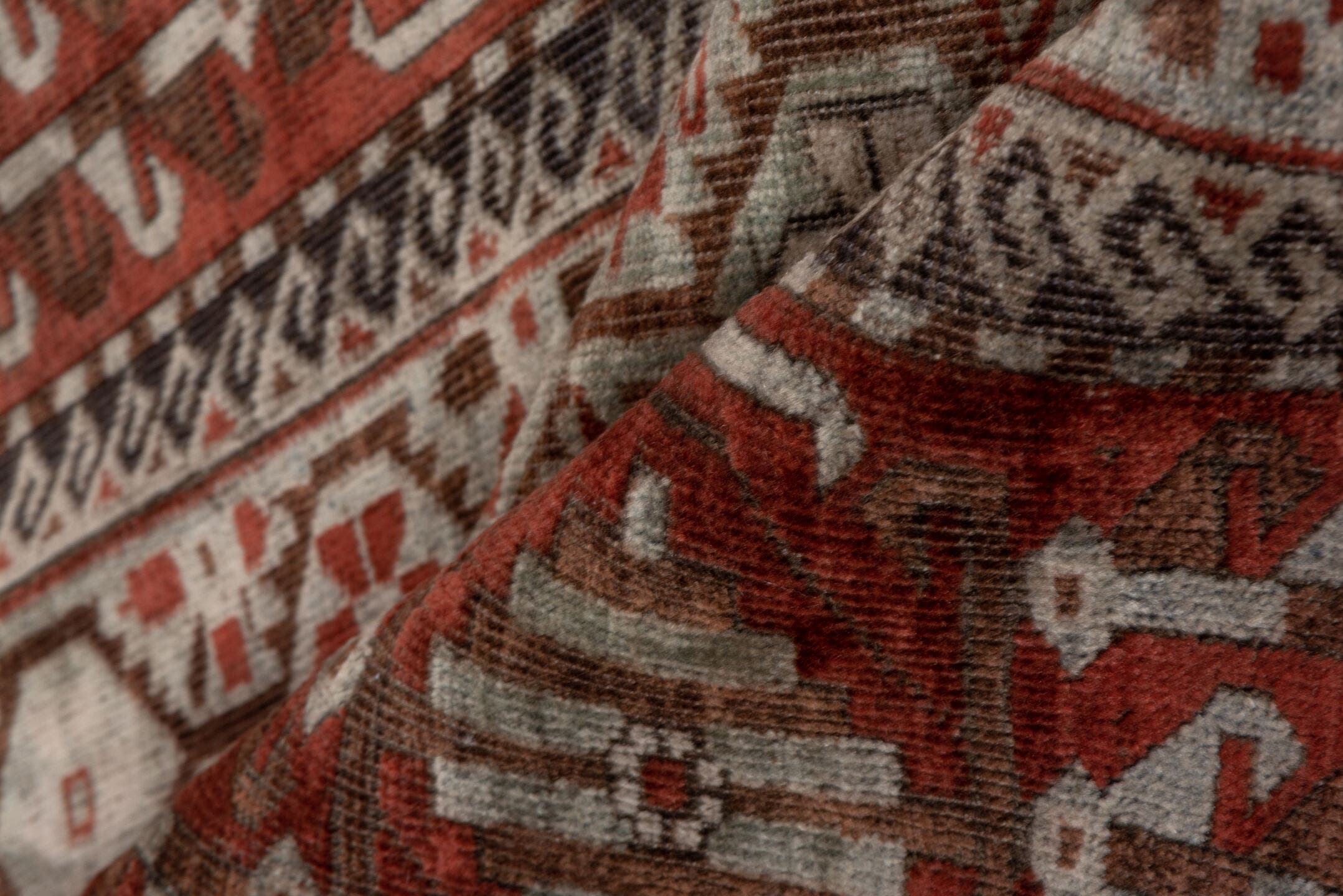 2' x 5' one-of-a-kind handmade antique Belouch small size rug. Color palette: rust, ivory, brown, camel, charcoal
