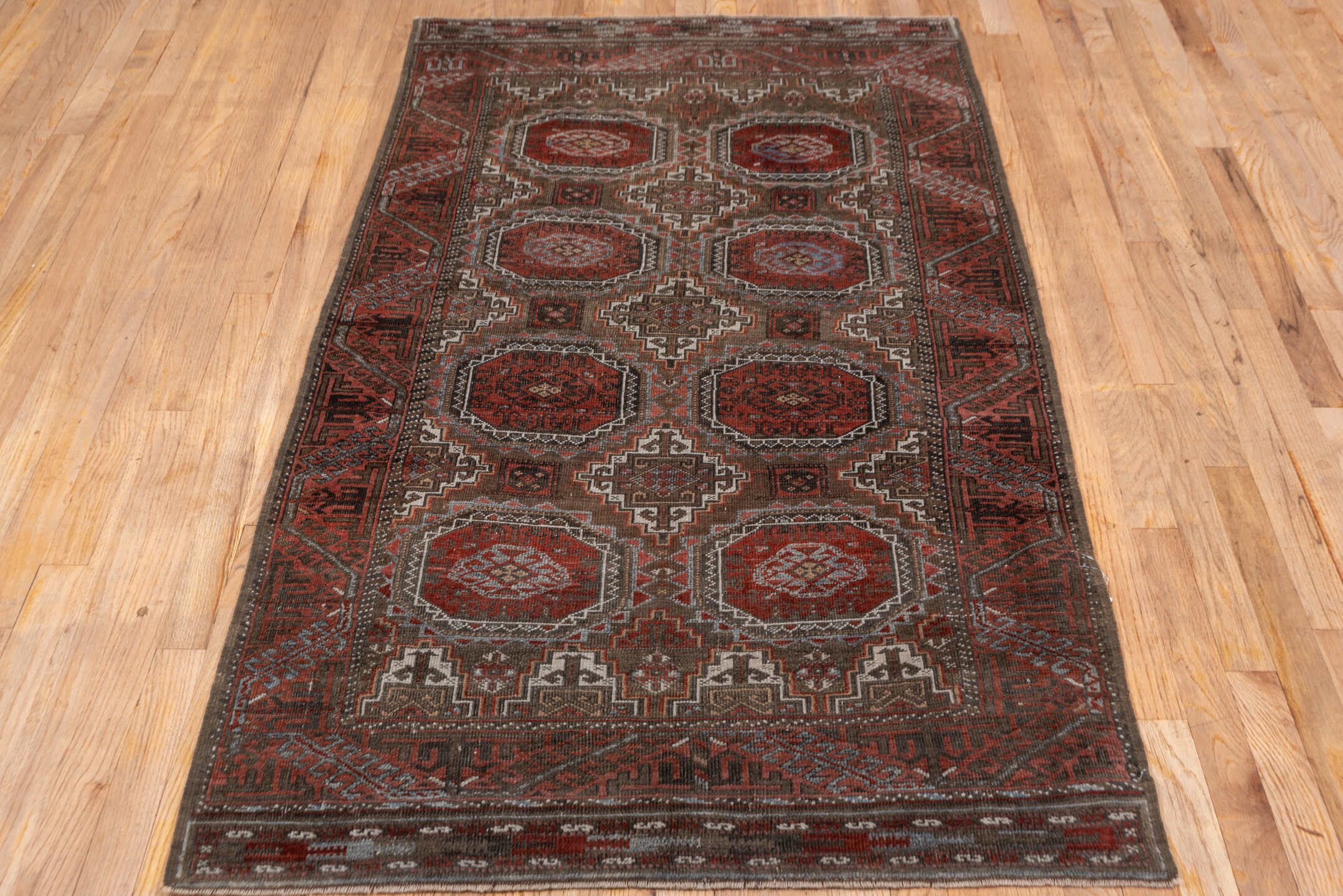 3' x 6' one-of-a-kind handmade vintage Belouch small size rug. Color palette: rust, brown, mahogany, ivory, charcoal, taupe