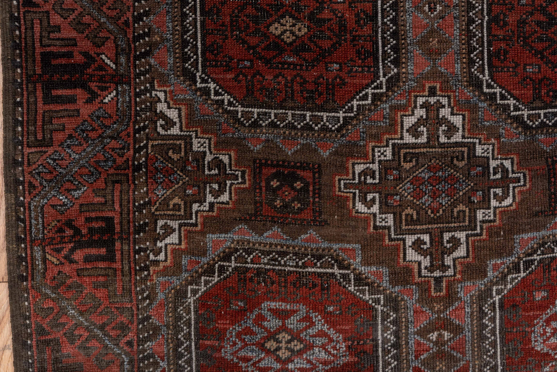 3' x 6' one-of-a-kind handmade vintage Belouch small size rug. Color palette: rust, brown, mahogany, ivory, charcoal, taupe