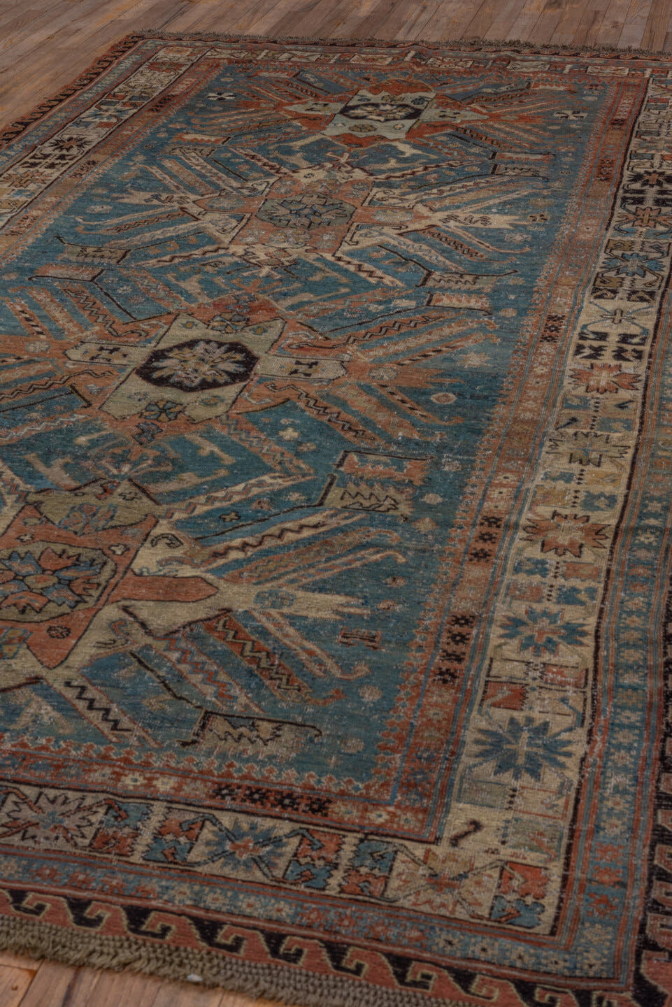 5' x 10' one-of-a-kind handmade antique Sumak medium size rug. Color palette: sky blue, ivory, rust, slate, camel, charcoal