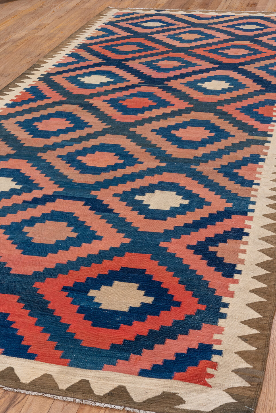 4' x 10' one-of-a-kind handmade vintage Kilim runner rug. Color palette: blue, brown, gray, off-white, orange, pink, red