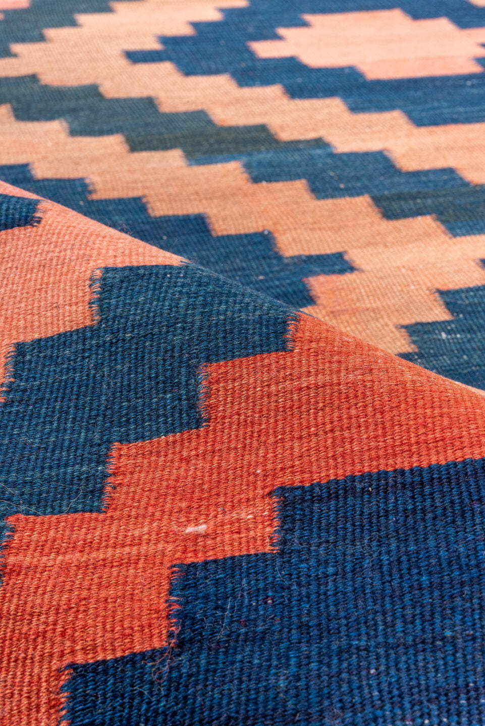 4' x 10' one-of-a-kind handmade vintage Kilim runner rug. Color palette: blue, brown, gray, off-white, orange, pink, red