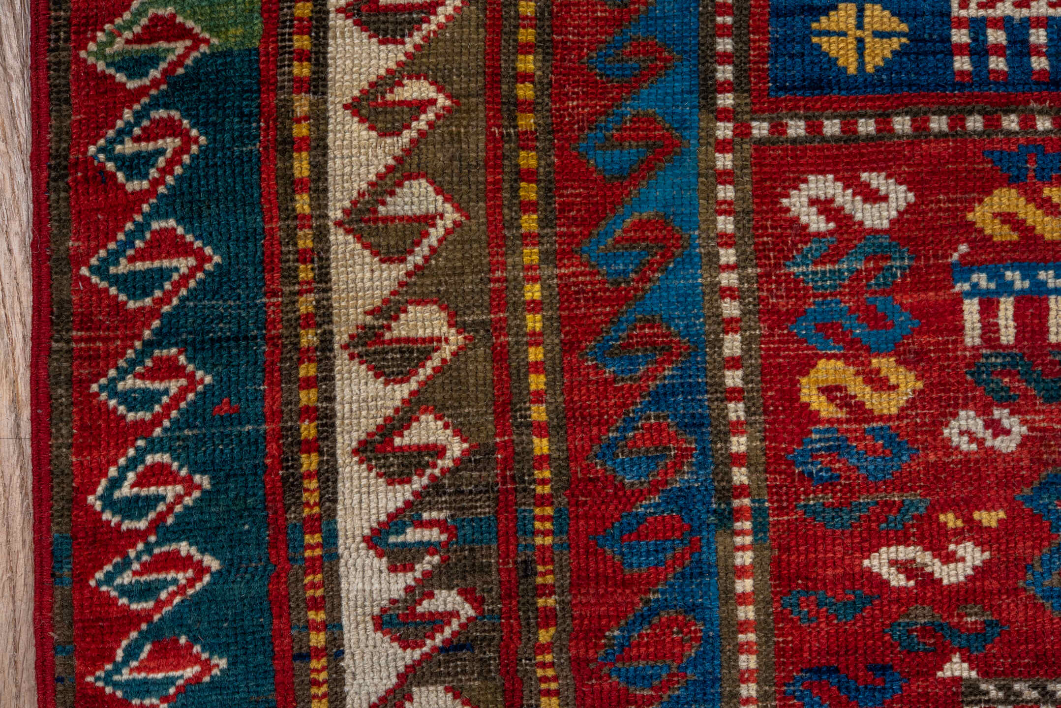 3' x 5' one-of-a-kind handmade antique Caucasian small size rug. Color palette: red, turquoise, ivory, blue, burgundy, camel