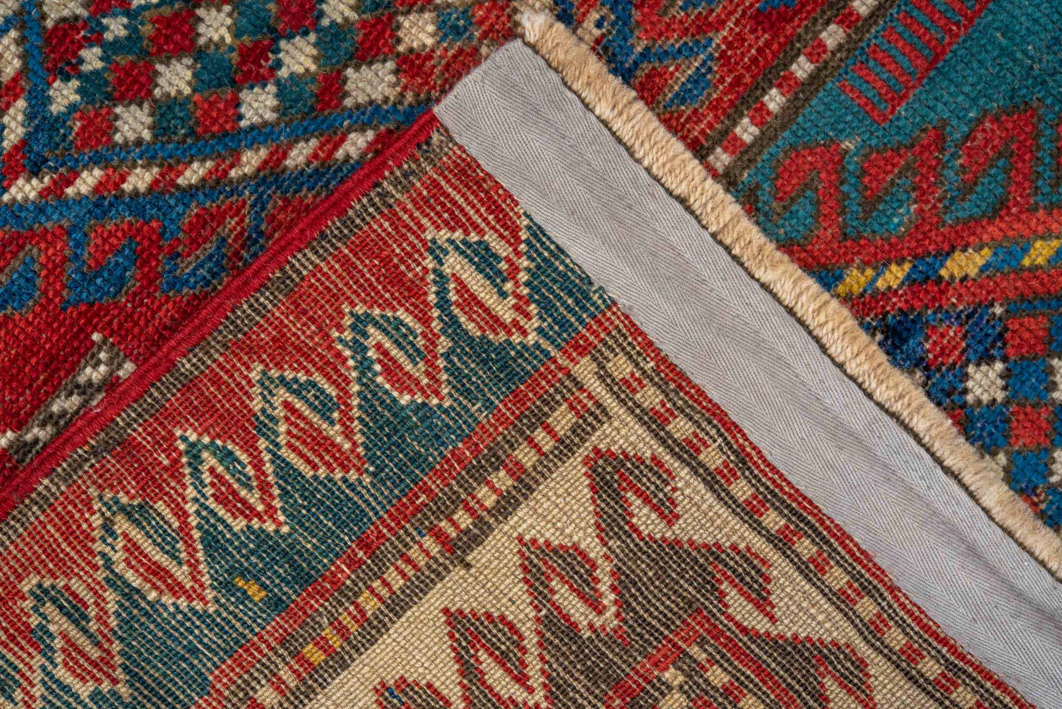 3' x 5' one-of-a-kind handmade antique Caucasian small size rug. Color palette: red, turquoise, ivory, blue, burgundy, camel