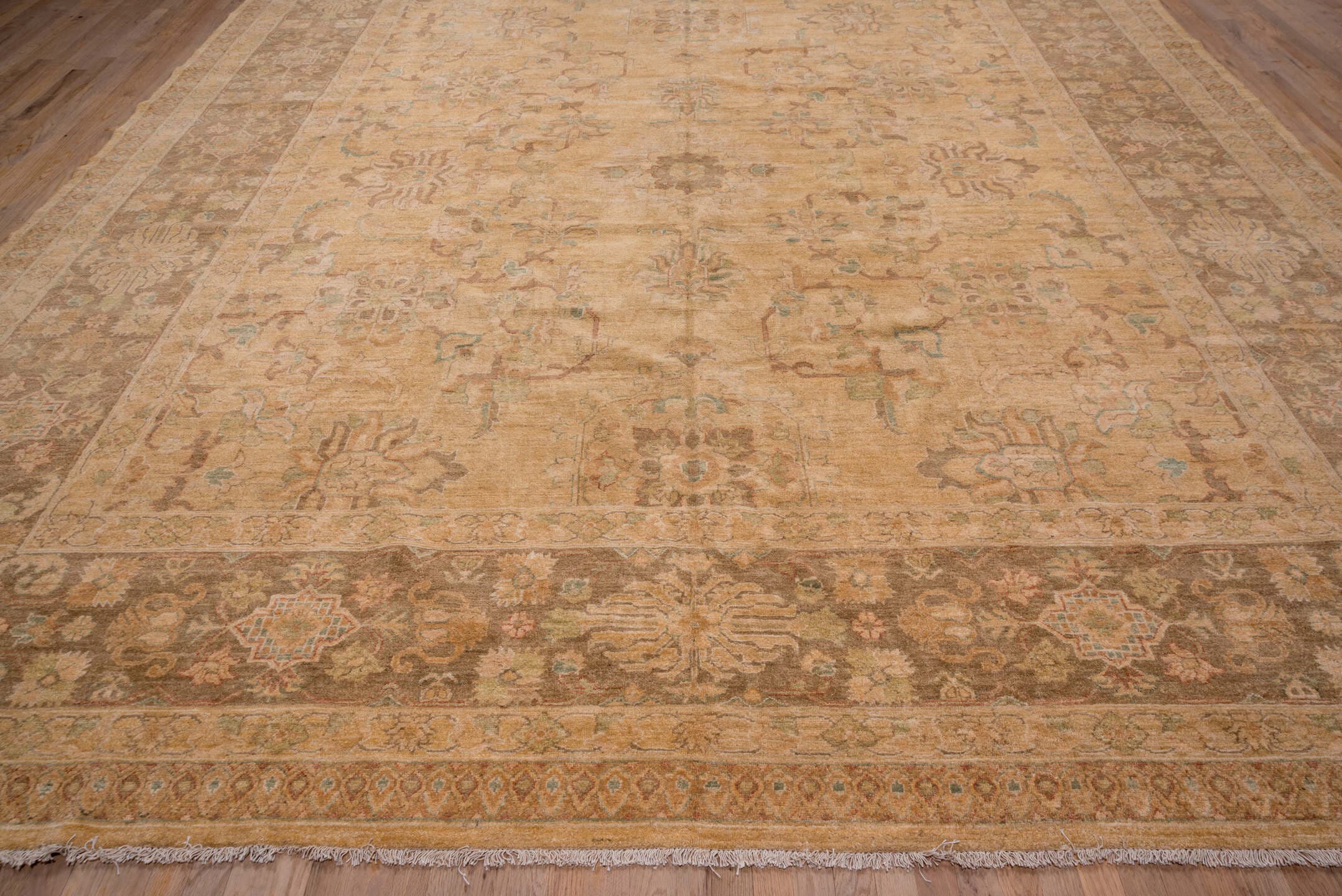 12' x 17' one-of-a-kind handmade vintage Pakistan oversize rug. Color palette: camel, taupe, brown, beige, sage, ivory
