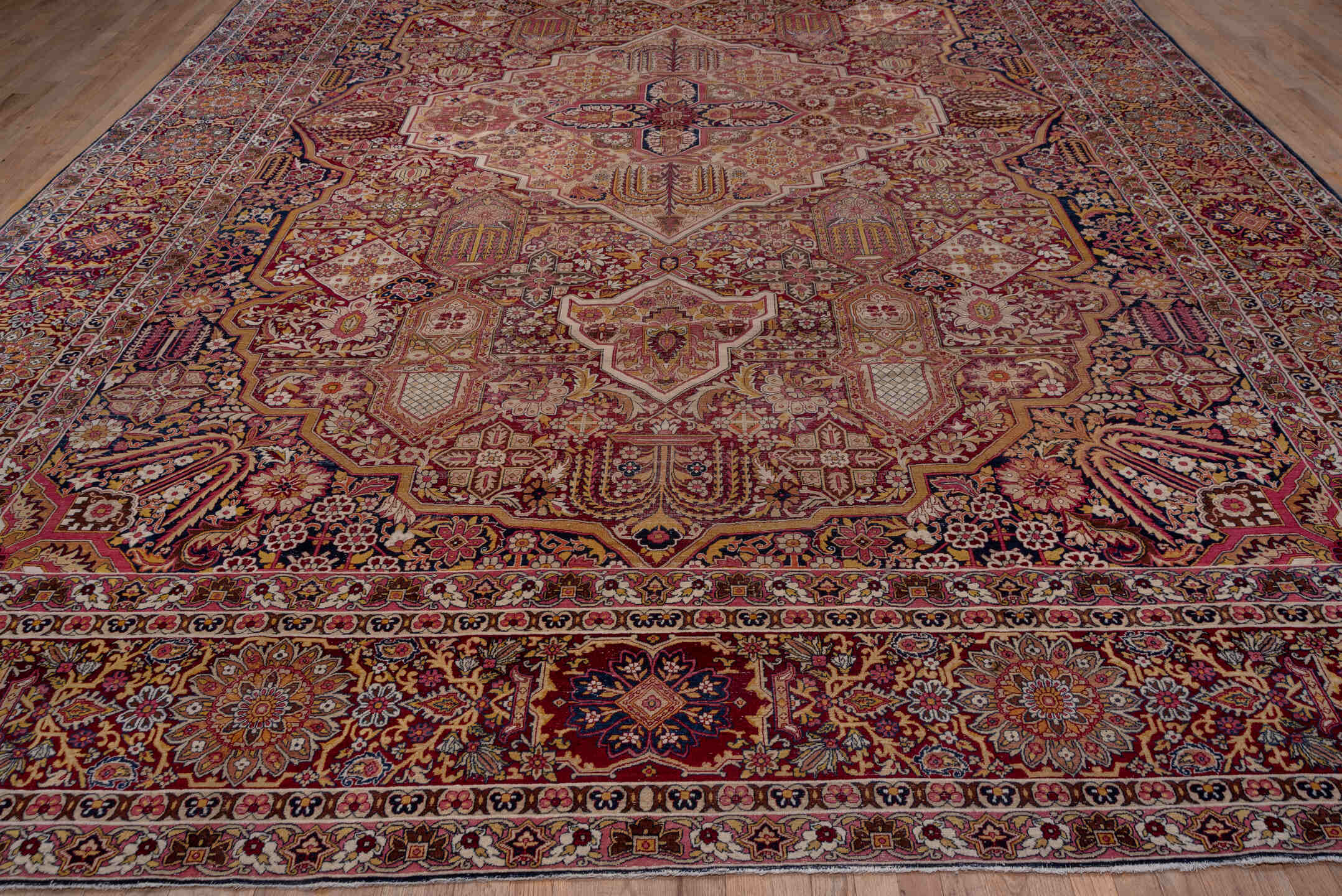 11' x 17' one-of-a-kind handmade antique Lavar oversize rug. Color palette: burgundy, ivory, navy, rose, gold, rust, camel
