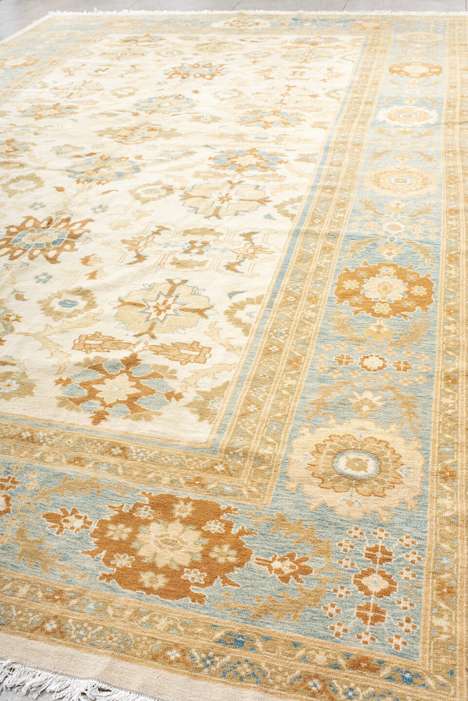 11' x 17' one-of-a-kind handmade vintage Sultanabad oversize rug. Color palette: ivory, sky blue, gold, camel, taupe, rust