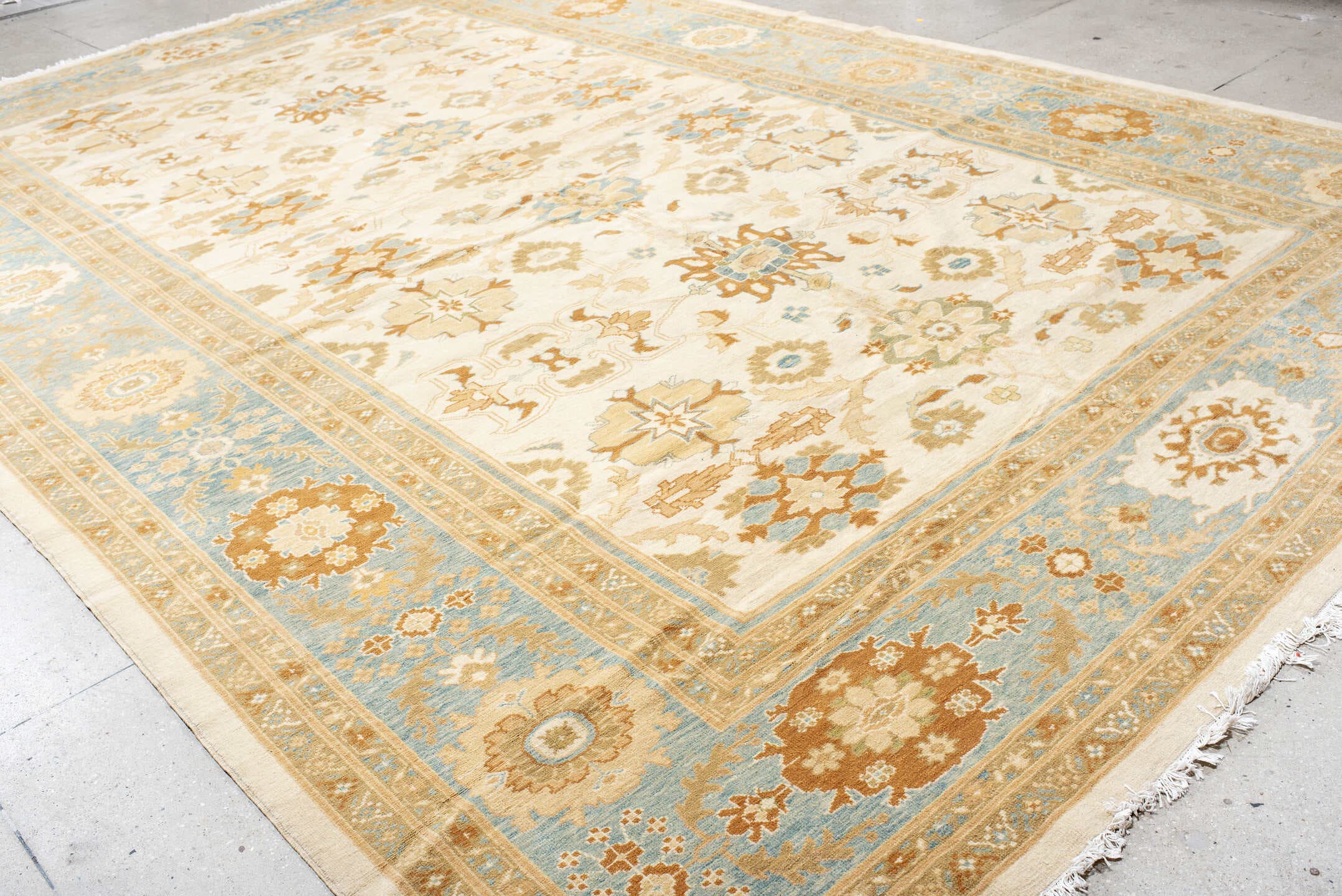 11' x 17' one-of-a-kind handmade vintage Sultanabad oversize rug. Color palette: ivory, sky blue, gold, camel, taupe, rust