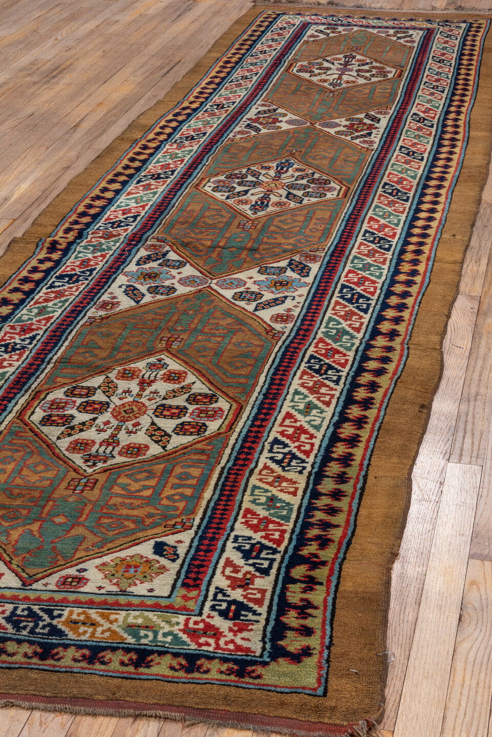 3' x 12' one-of-a-kind handmade antique Cam Hamadan runner rug. Color palette: camel, ivory, rust, navy, sage, terra cotta