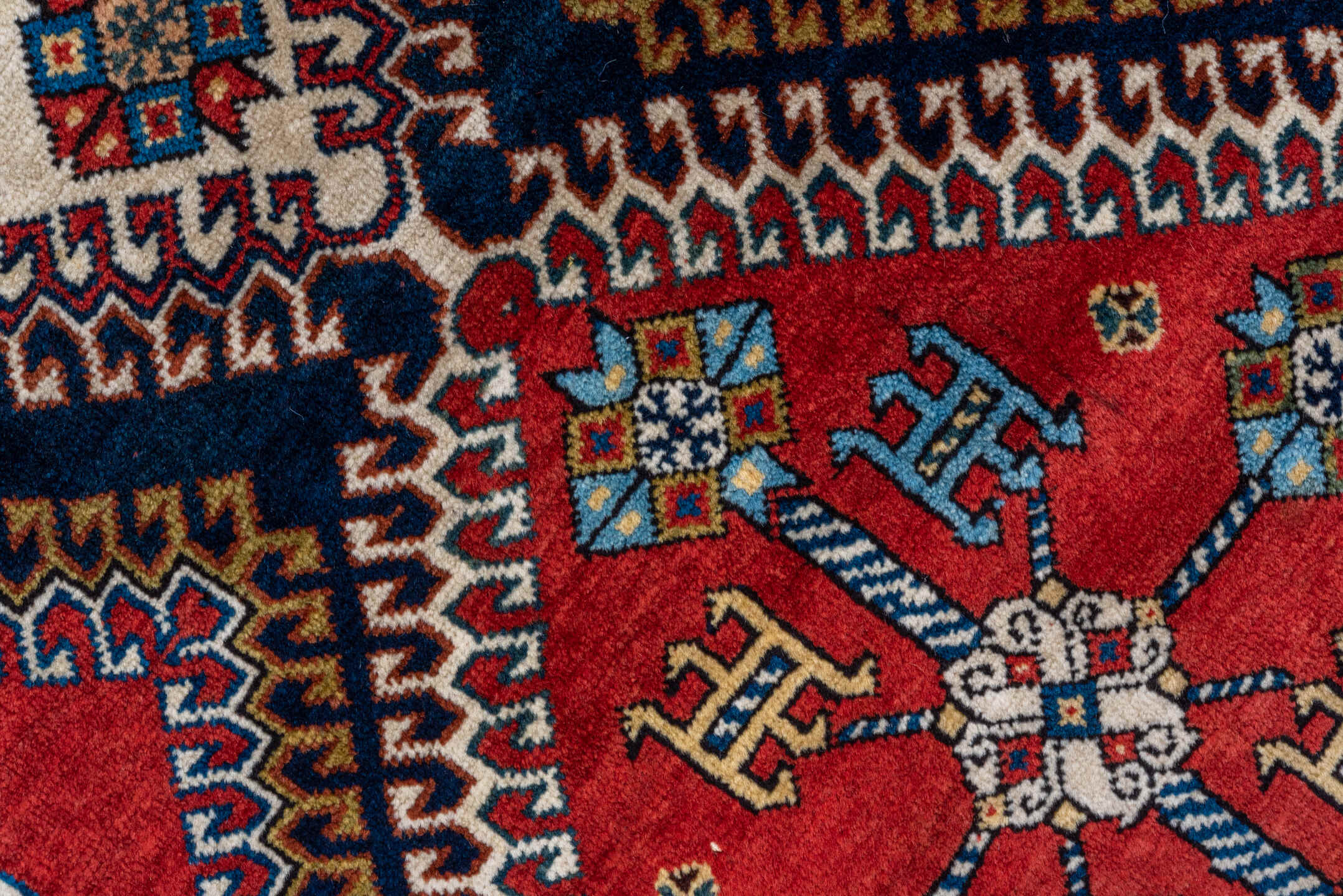 4' x 7' one-of-a-kind handmade vintage Qashqai rug. Color palette: crimson, ivory, indigo, camel, sky_blue, rust, black, red