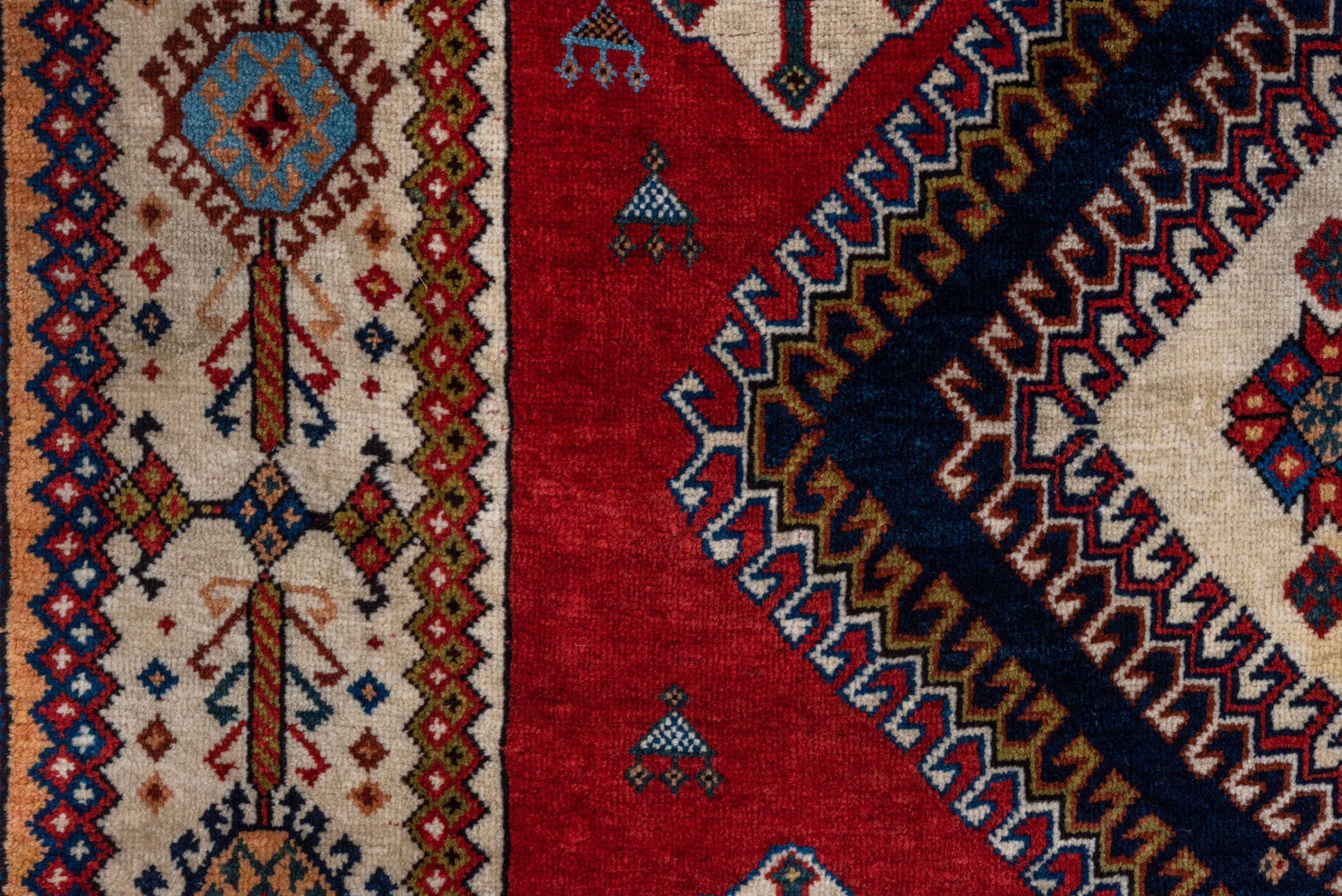 4' x 7' one-of-a-kind handmade vintage Qashqai rug. Color palette: crimson, ivory, indigo, camel, sky_blue, rust, black, red