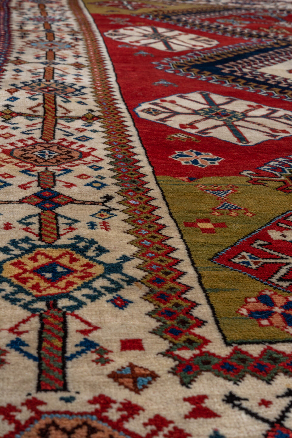 4' x 7' one-of-a-kind handmade vintage Qashqai rug. Color palette: crimson, ivory, indigo, camel, sky_blue, rust, black, red