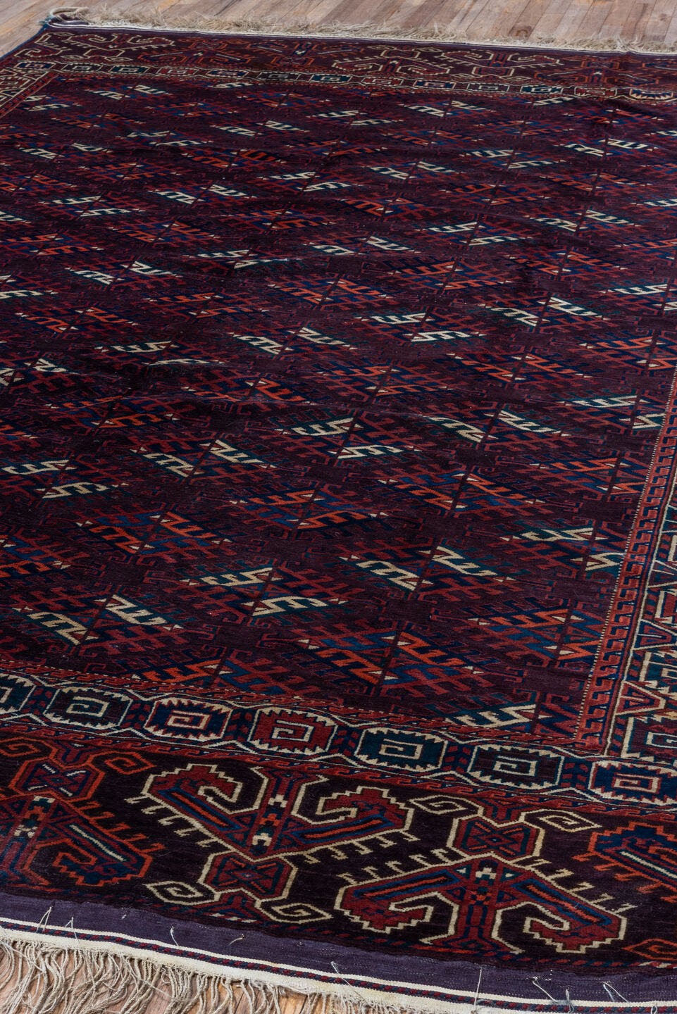 6' x 10' one-of-a-kind handmade vintage Yamoud large size rug. Color palette: burgundy, navy, rust, ivory, crimson, indigo