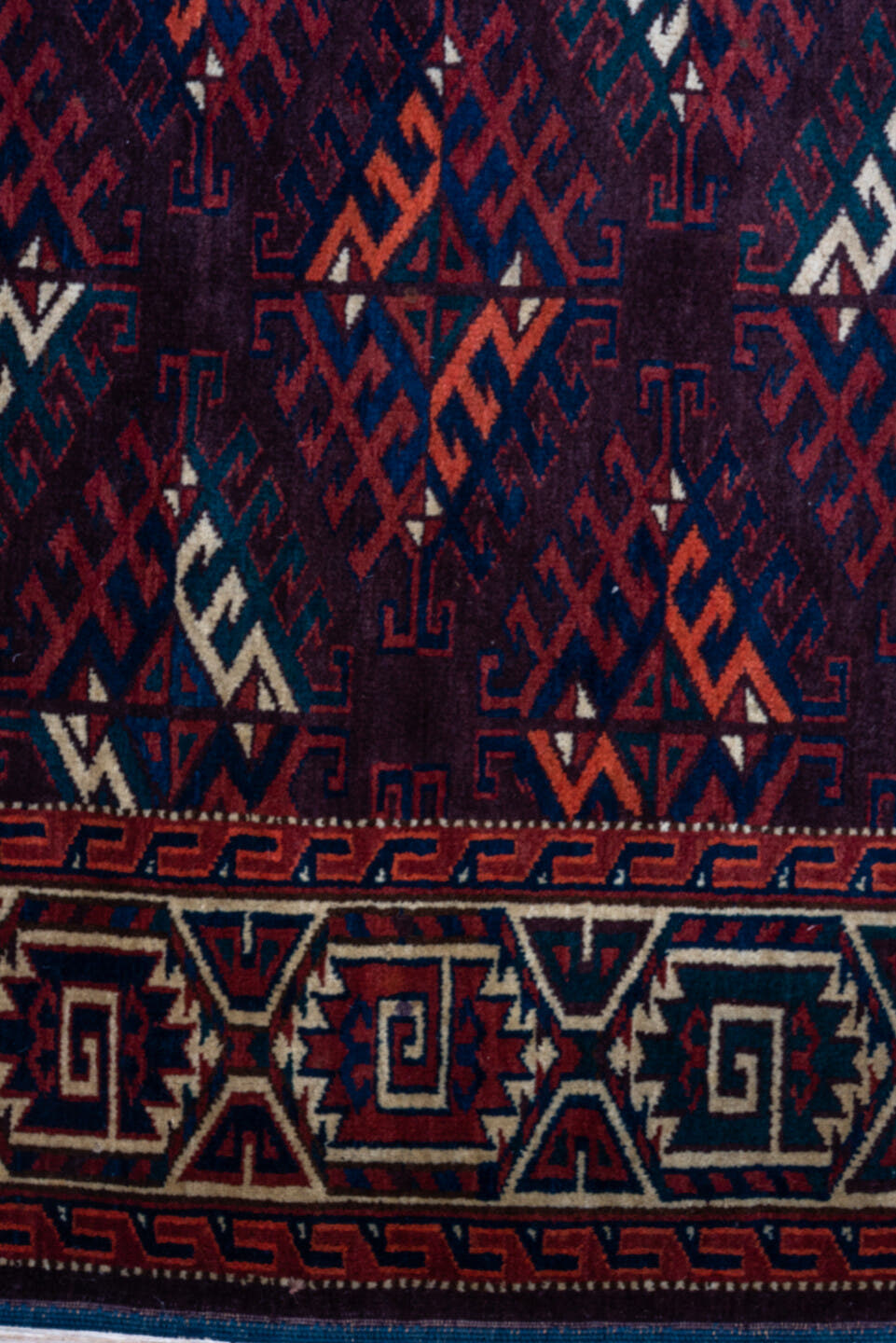 6' x 10' one-of-a-kind handmade vintage Yamoud large size rug. Color palette: burgundy, navy, rust, ivory, crimson, indigo