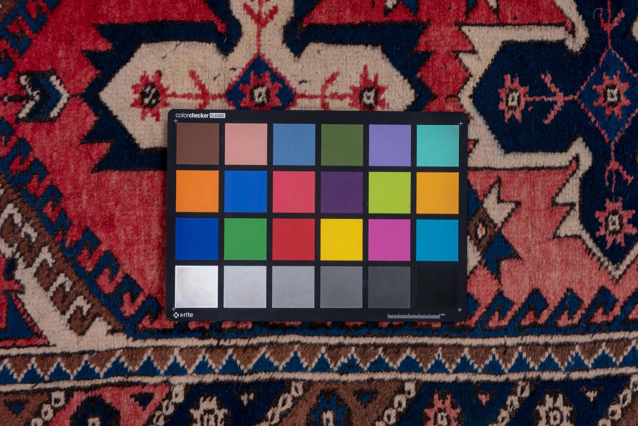 2' x 9' one-of-a-kind handmade vintage Oushak runner rug. Color palette: rose, navy, ivory, rust, brown, slate, pink, red
