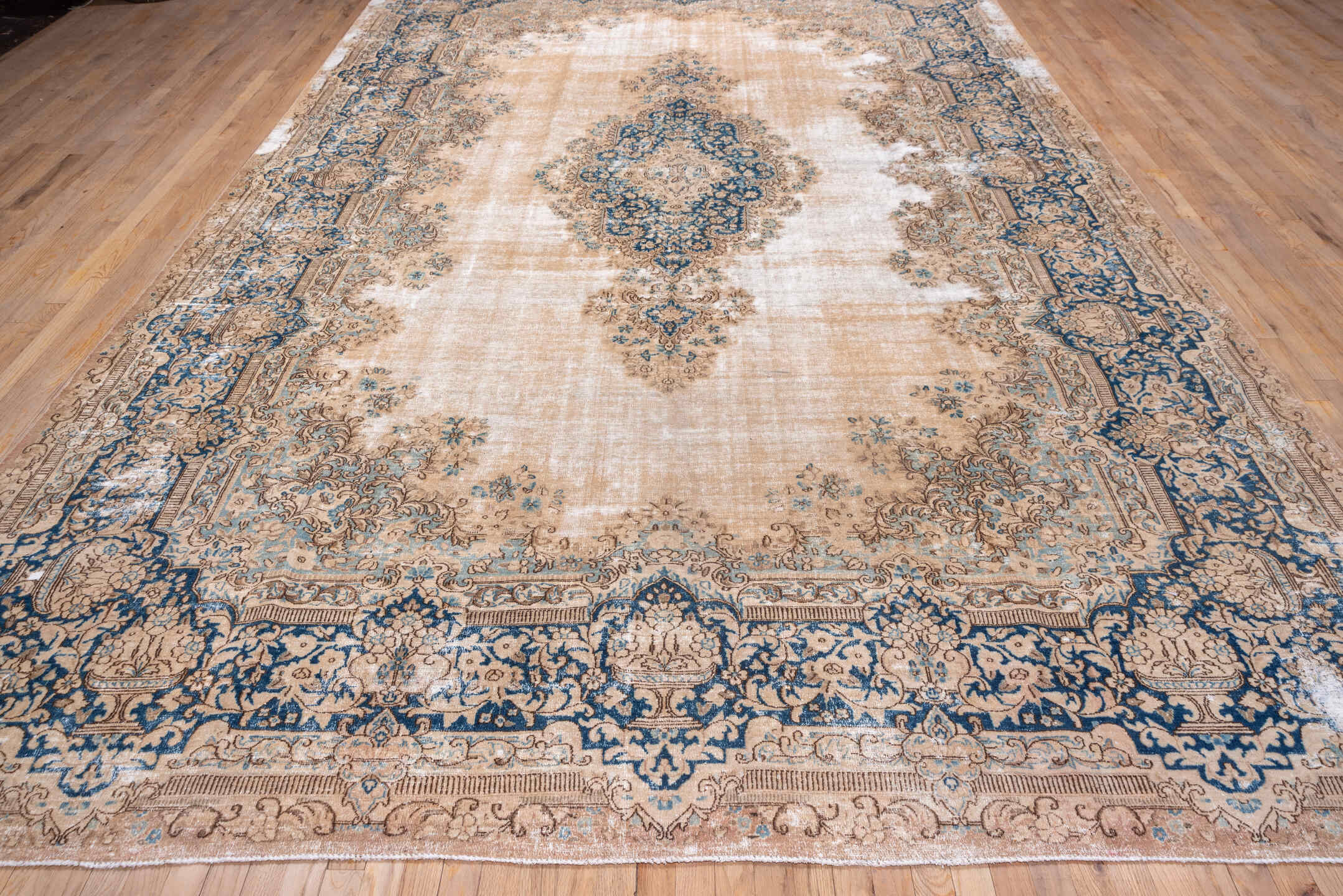 9' x 15' one-of-a-kind handmade vintage Kerman rug. Color palette: ivory, beige, cobalt, camel, taupe, light blue, sand