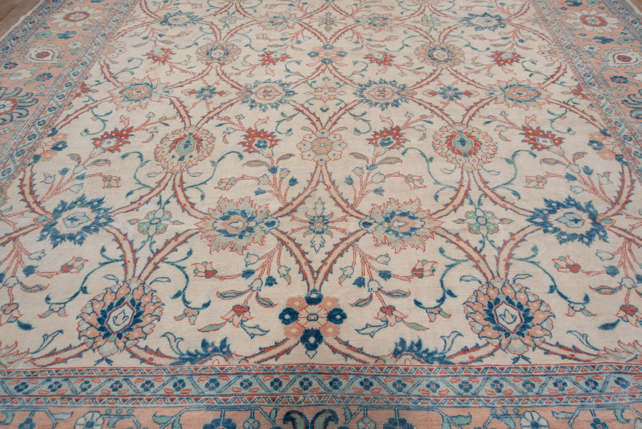12' x 19' one-of-a-kind handmade vintage  oversize rug. Color palette: ivory, peach, sky blue, rust, sage, taupe, terracotta