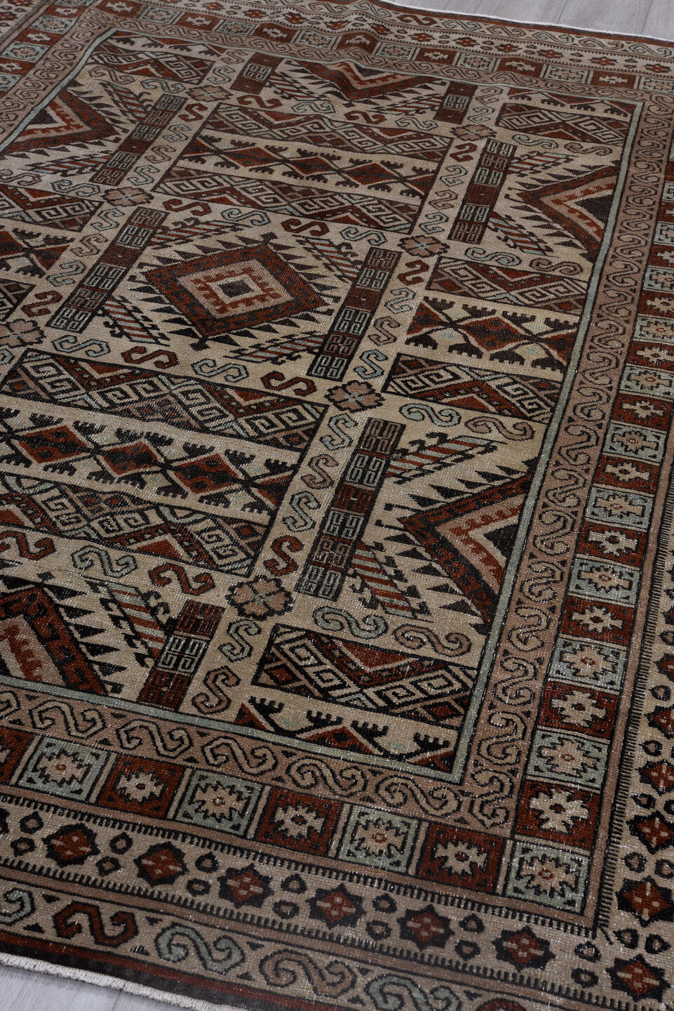 6' x 8' one-of-a-kind handmade antique Khotan medium size rug. Color palette: ivory, rust, brown, pale_blue, charcoal, taupe