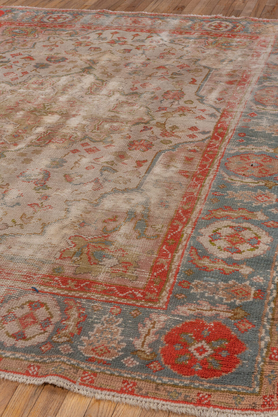 7' x 9' one-of-a-kind handmade antique Oushak rug. Color palette: ivory, powder_blue, coral, taupe, muted_gold, sage