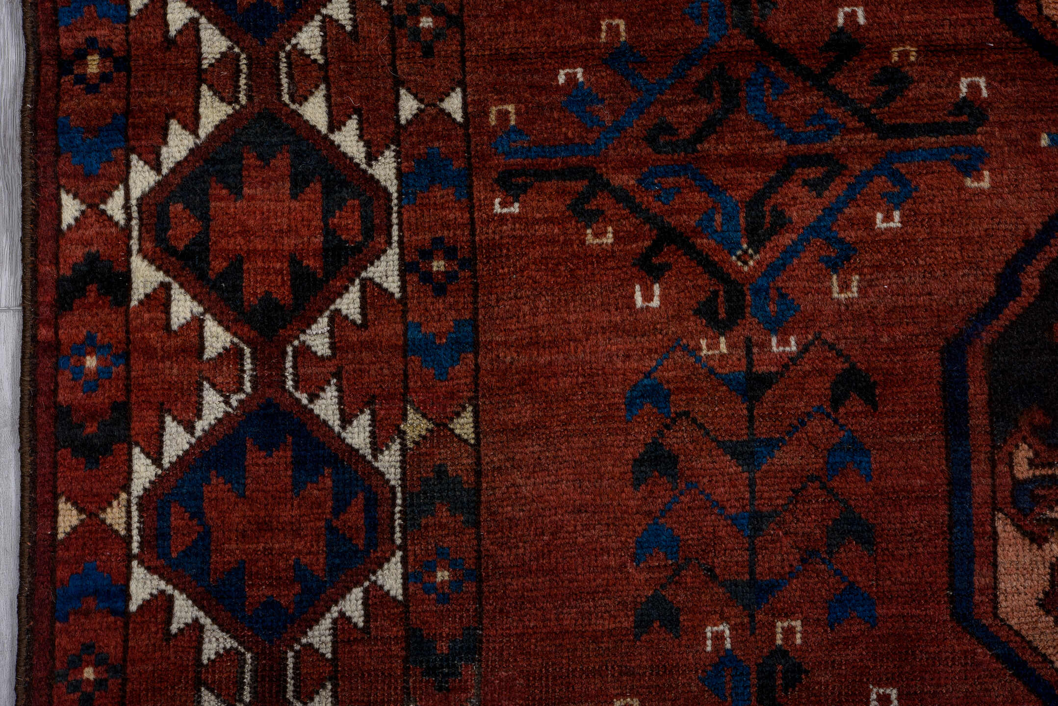 6' x 7' one-of-a-kind handmade vintage Afghan rug. Color palette: black, brown, gray, light gray, off-white, pink, red