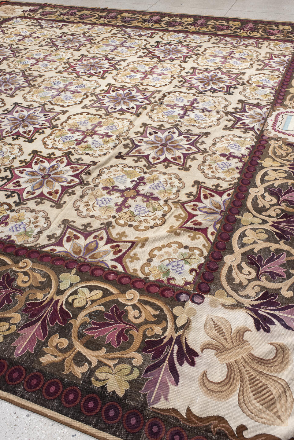 14' x 15' one-of-a-kind handmade antique Needlepoint oversize rug. Color palette: ivory, brown, burgundy, rose, taupe, sage