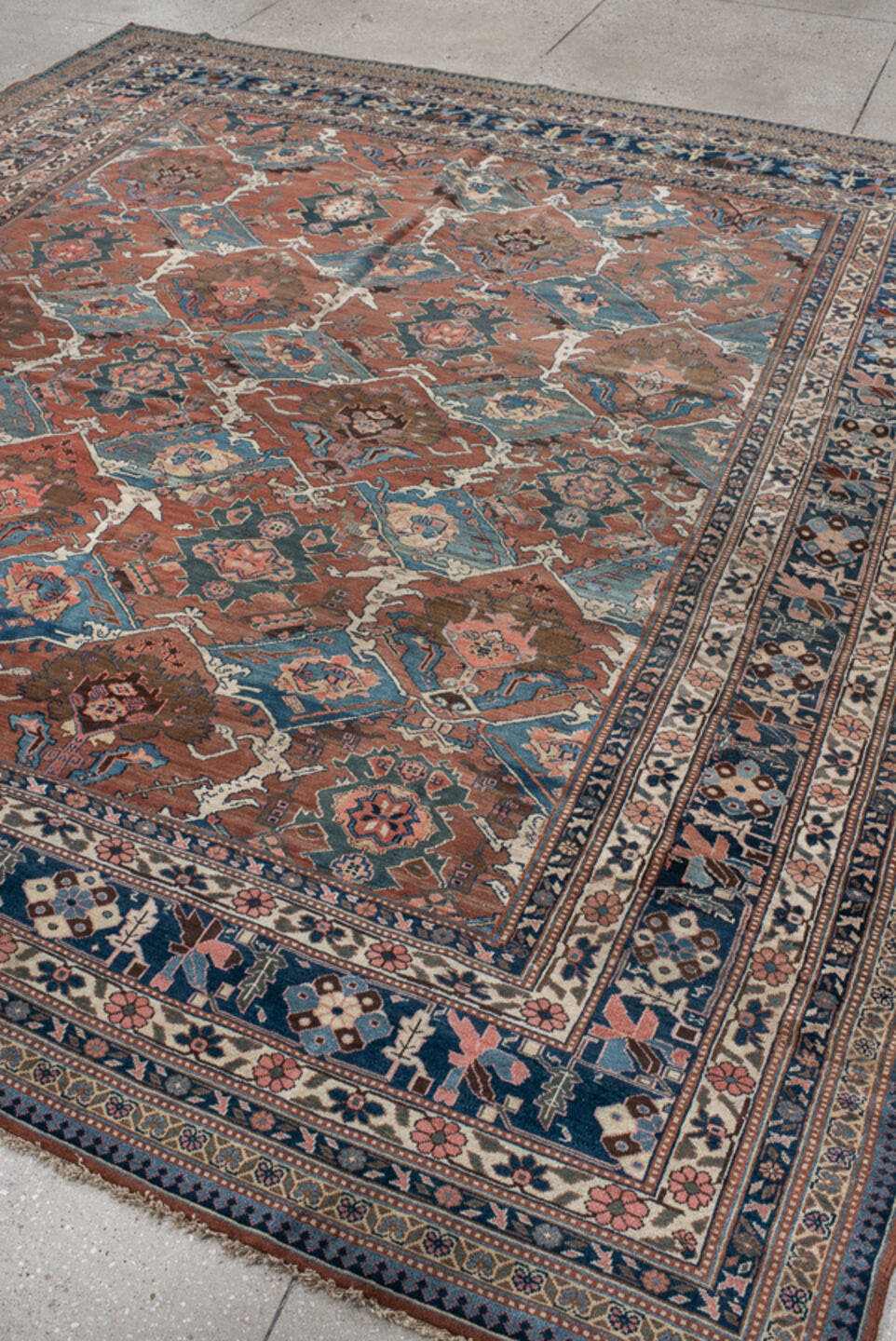 9' x 10' one-of-a-kind handmade antique Bakhshayesh large size rug. Color palette: terra cotta, navy, ivory, sky blue, camel