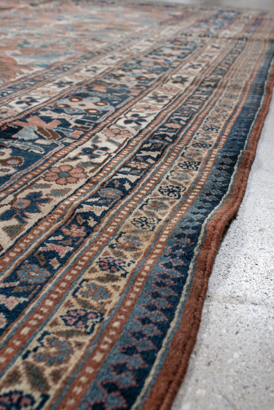 9' x 10' one-of-a-kind handmade antique Bakhshayesh large size rug. Color palette: terra cotta, navy, ivory, sky blue, camel