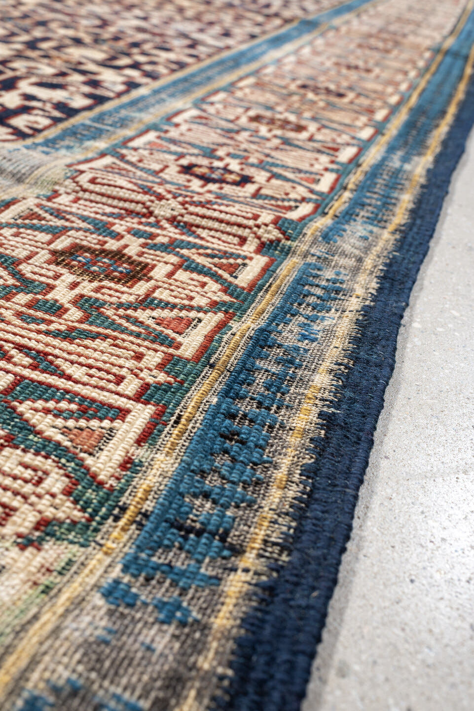3' x 10' one-of-a-kind handmade antique Kuba runner rug. Color palette: indigo, ivory, rust, sky blue, camel, slate, purple