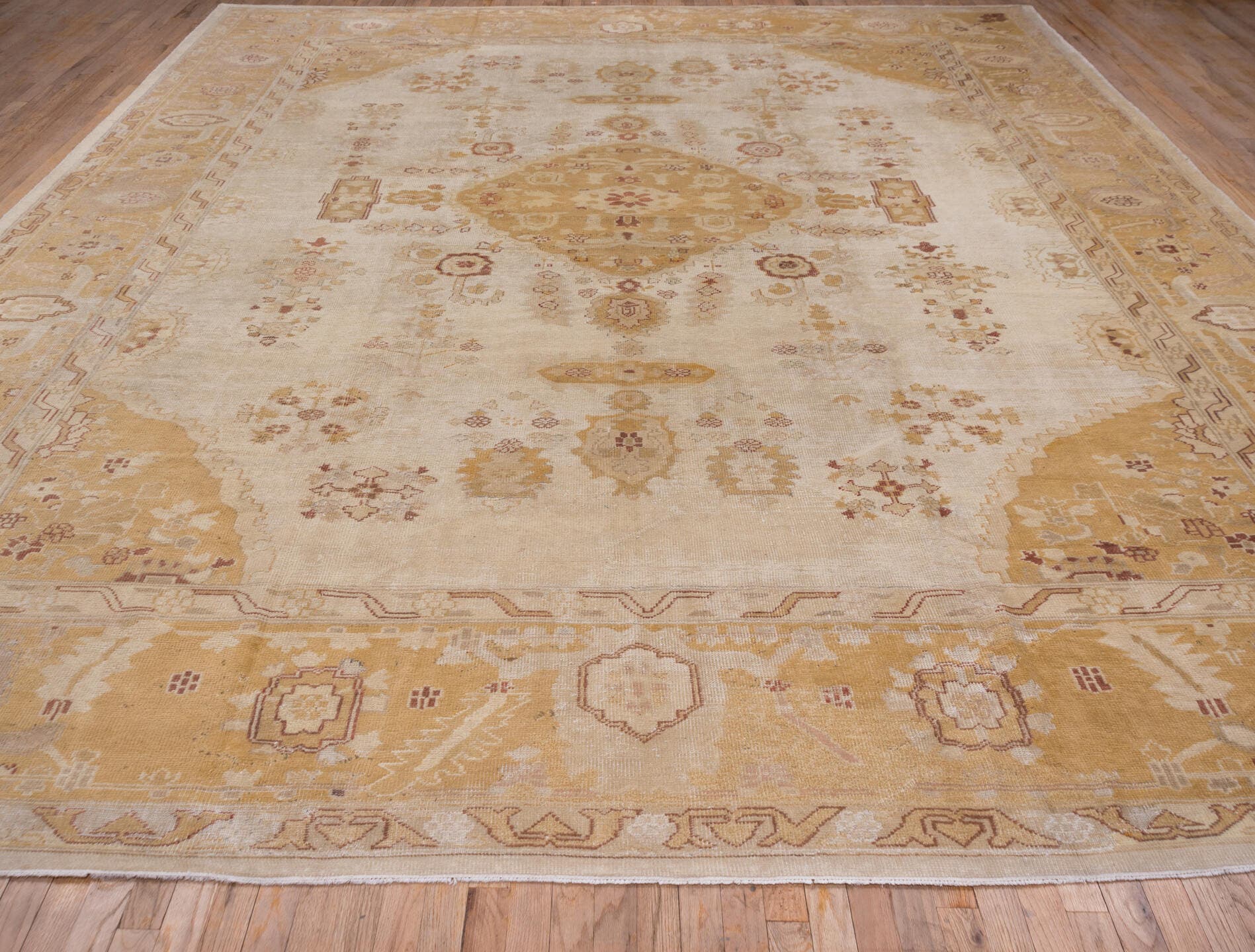 12' x 14' one-of-a-kind handmade antique Oushak oversize rug. Color palette: ivory, gold, camel, blush, taupe, rust, sage