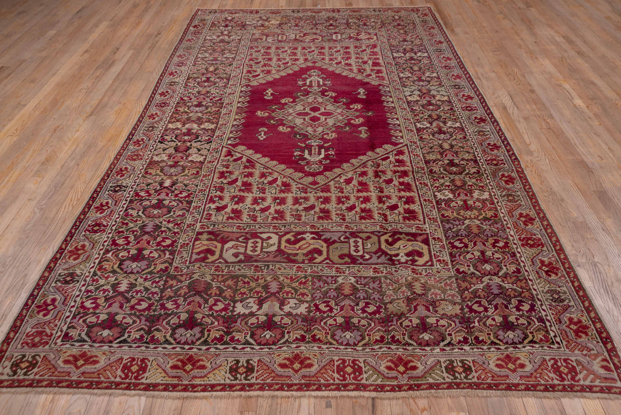 6' x 11' one-of-a-kind handmade vintage Ghordes large size rug. Color palette: brown, gray, off-white, pink, red, snow