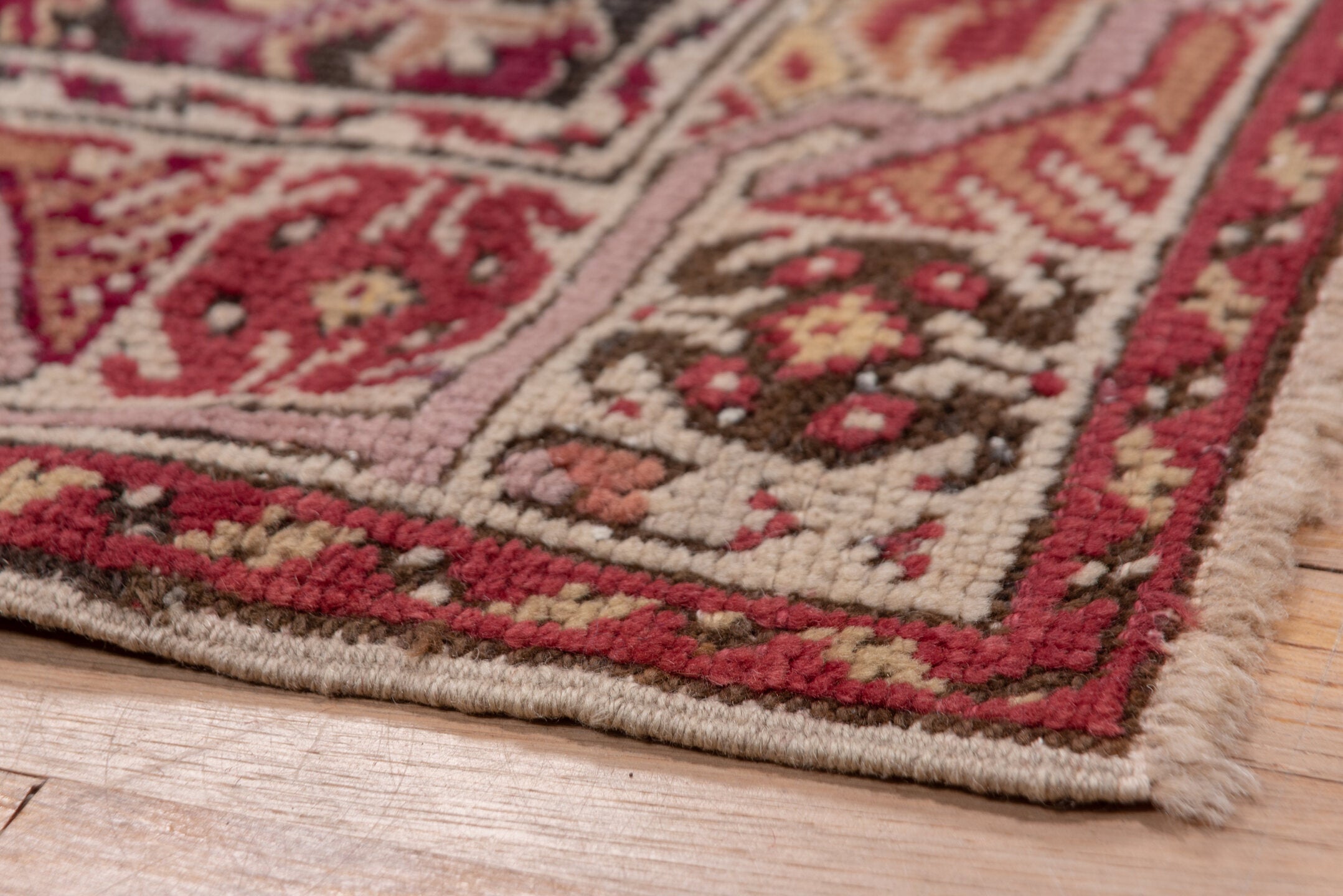6' x 11' one-of-a-kind handmade vintage Ghordes large size rug. Color palette: brown, gray, off-white, pink, red, snow