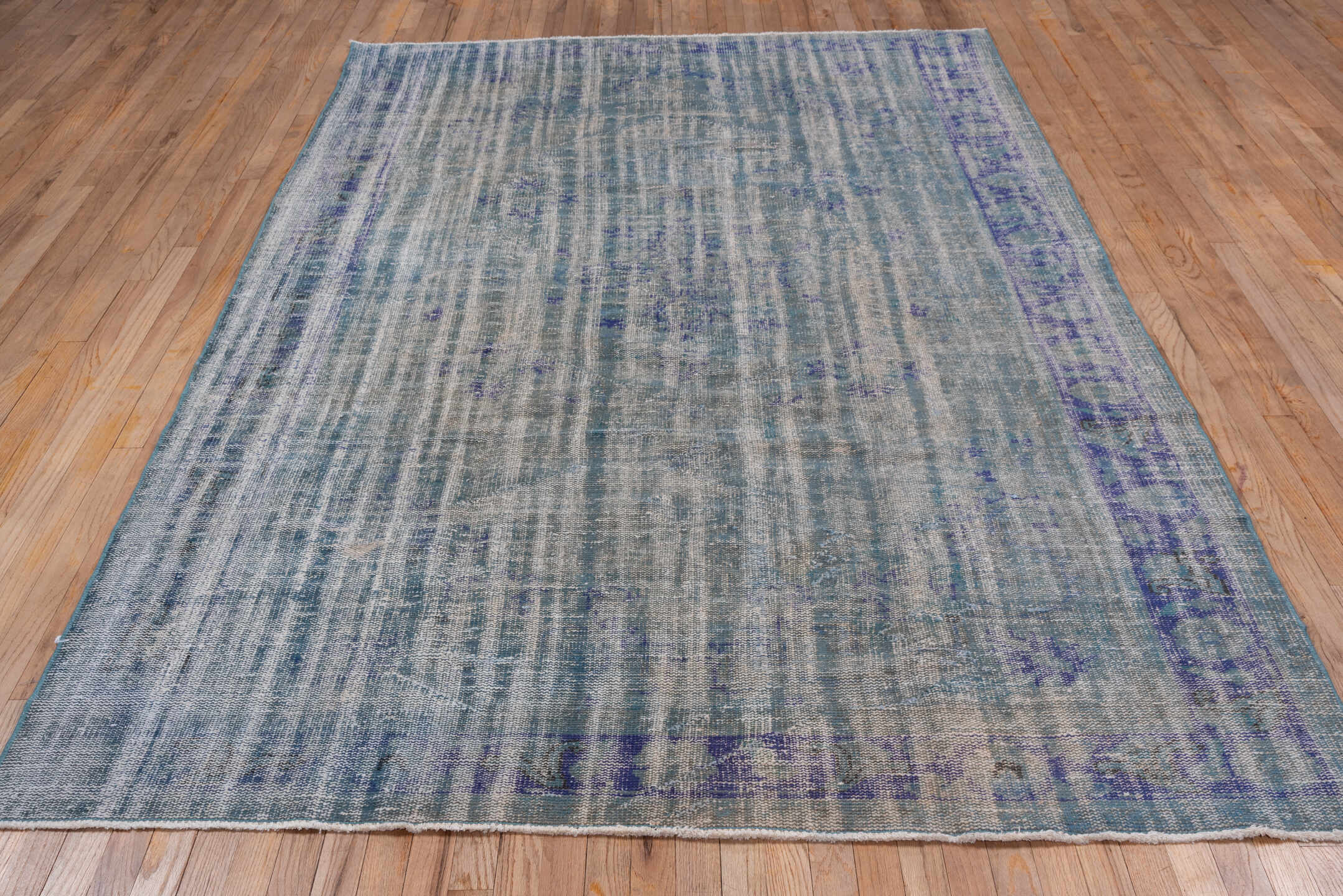 6' x 9' one-of-a-kind handmade vintage Sparta medium size rug. Color palette: blue, gray, light gray, off-white, silver