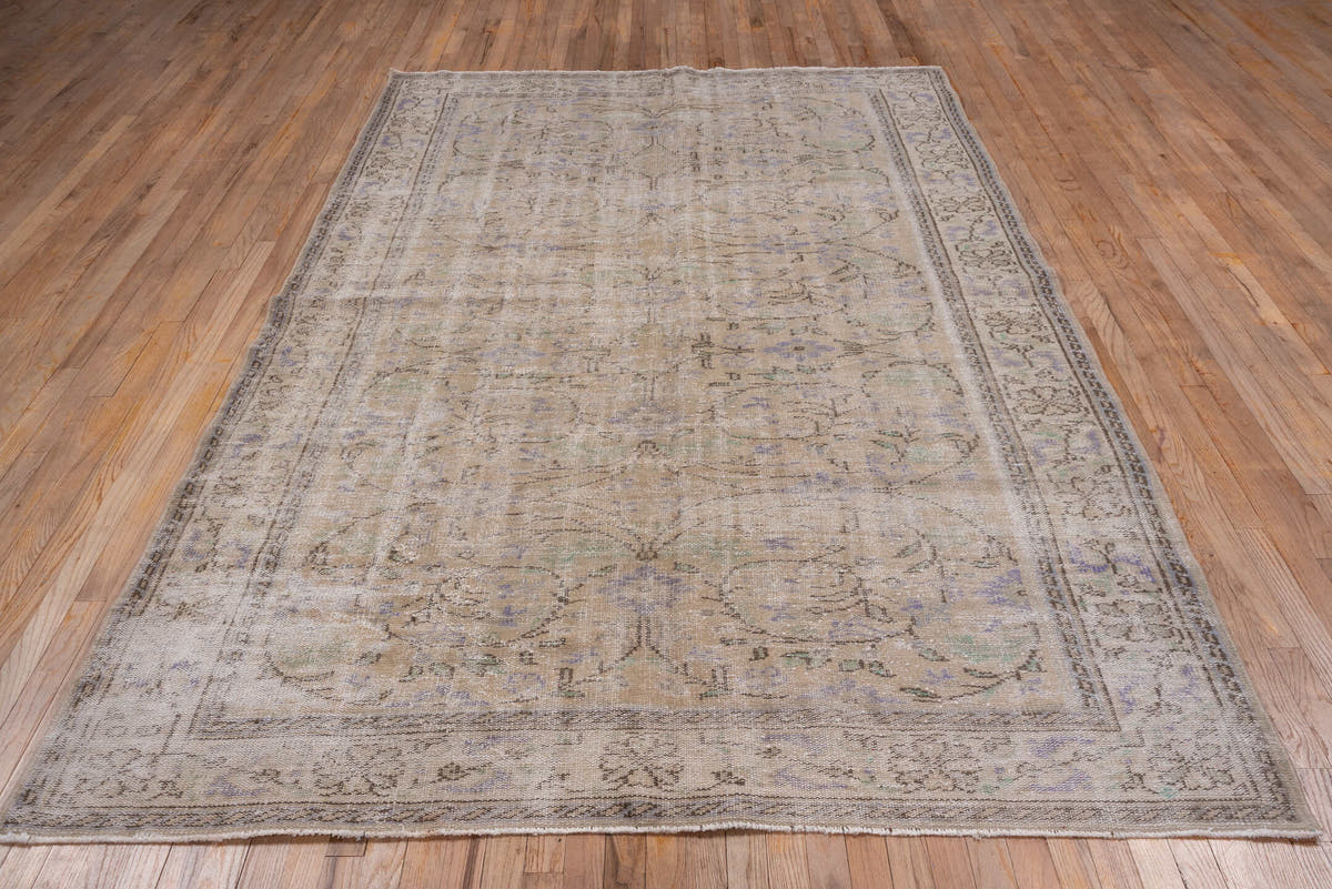 6' x 9' one-of-a-kind handmade vintage Sparta medium size rug. Color palette: taupe, beige, ivory, lavender, sage, brown