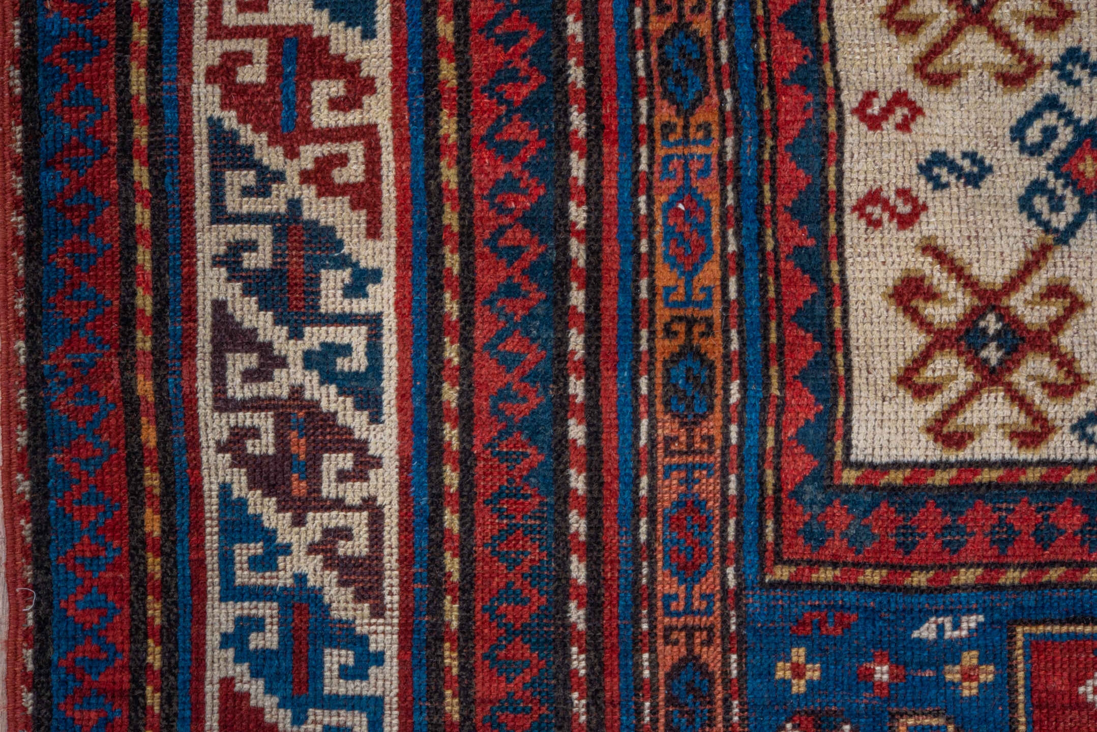 3' x 6' one-of-a-kind handmade antique Kazak runner rug. Color palette: blue, ivory, red, navy, rust, teal, brown