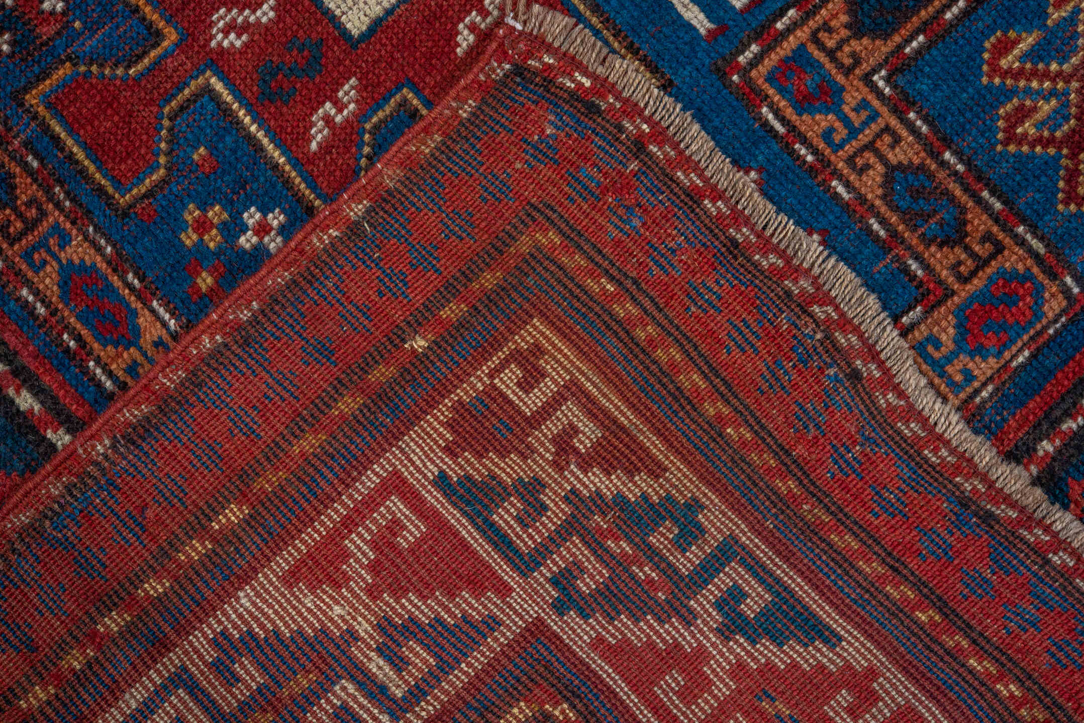 3' x 6' one-of-a-kind handmade antique Kazak runner rug. Color palette: blue, ivory, red, navy, rust, teal, brown