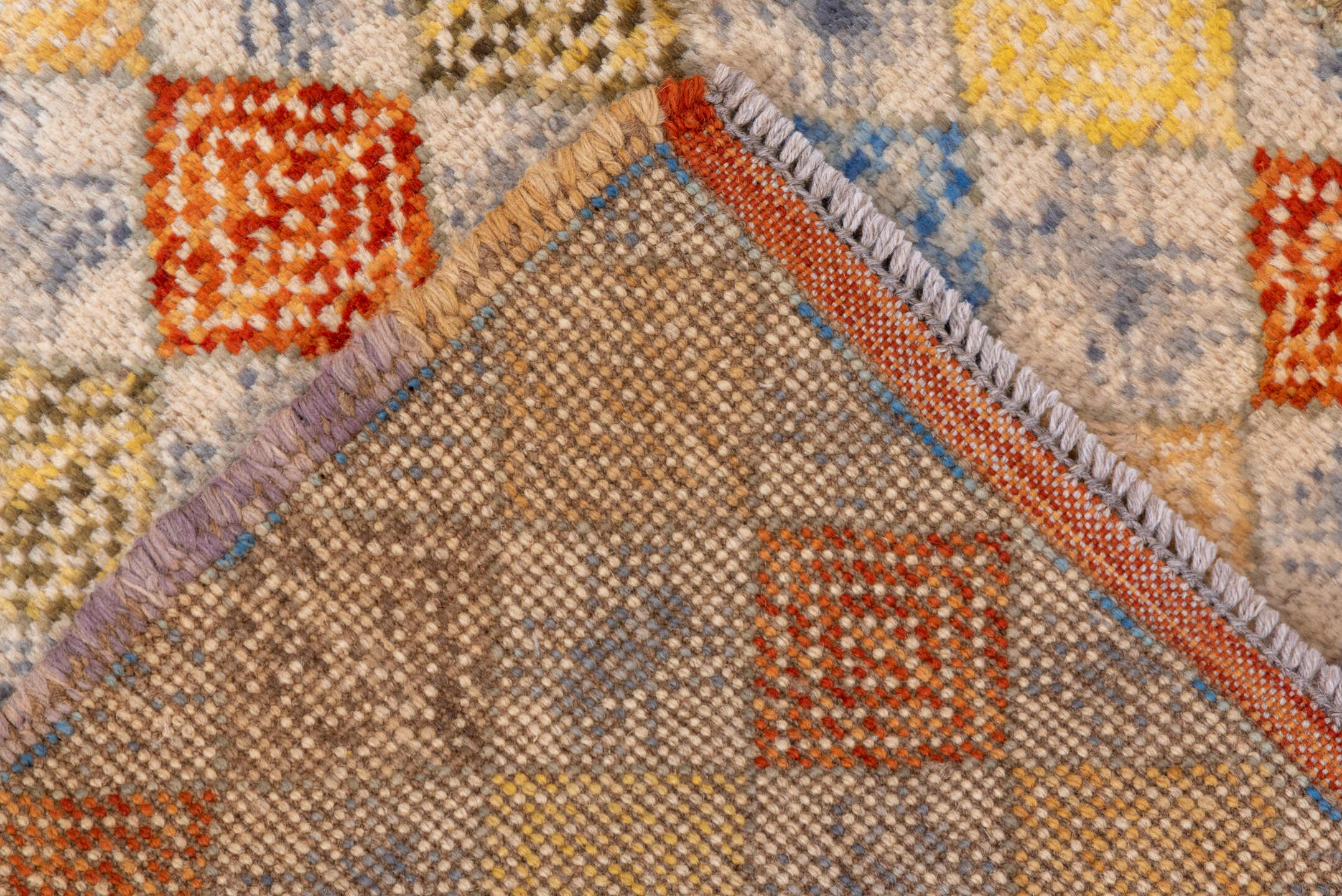 2' x 5' one-of-a-kind handmade vintage Gabbe small size rug. Color palette: ivory, gold, lavender, rust, sky blue, camel