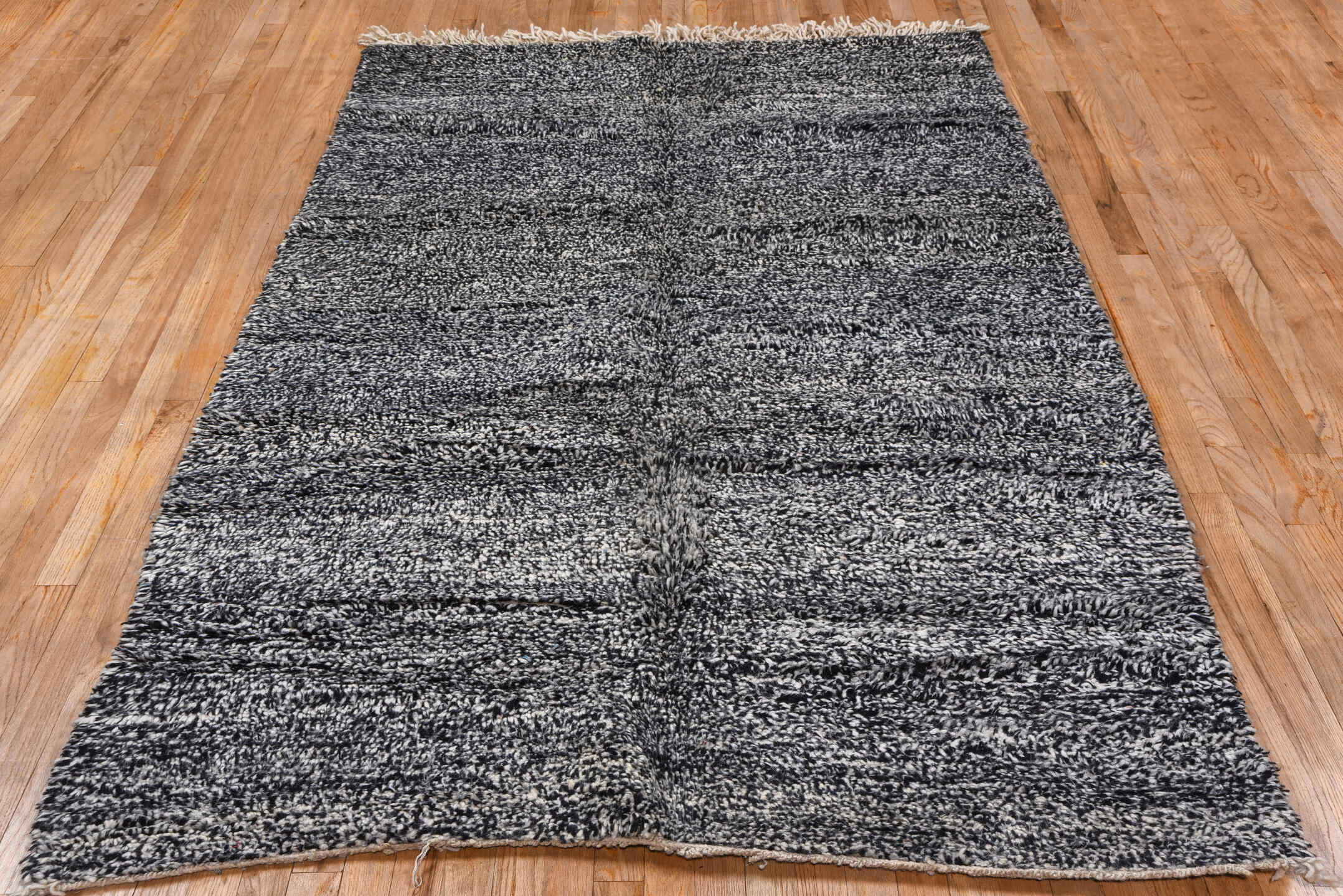 5' x 7' one-of-a-kind handmade vintage Moroccan rug. Color palette: charcoal, ivory, black, cream, gray