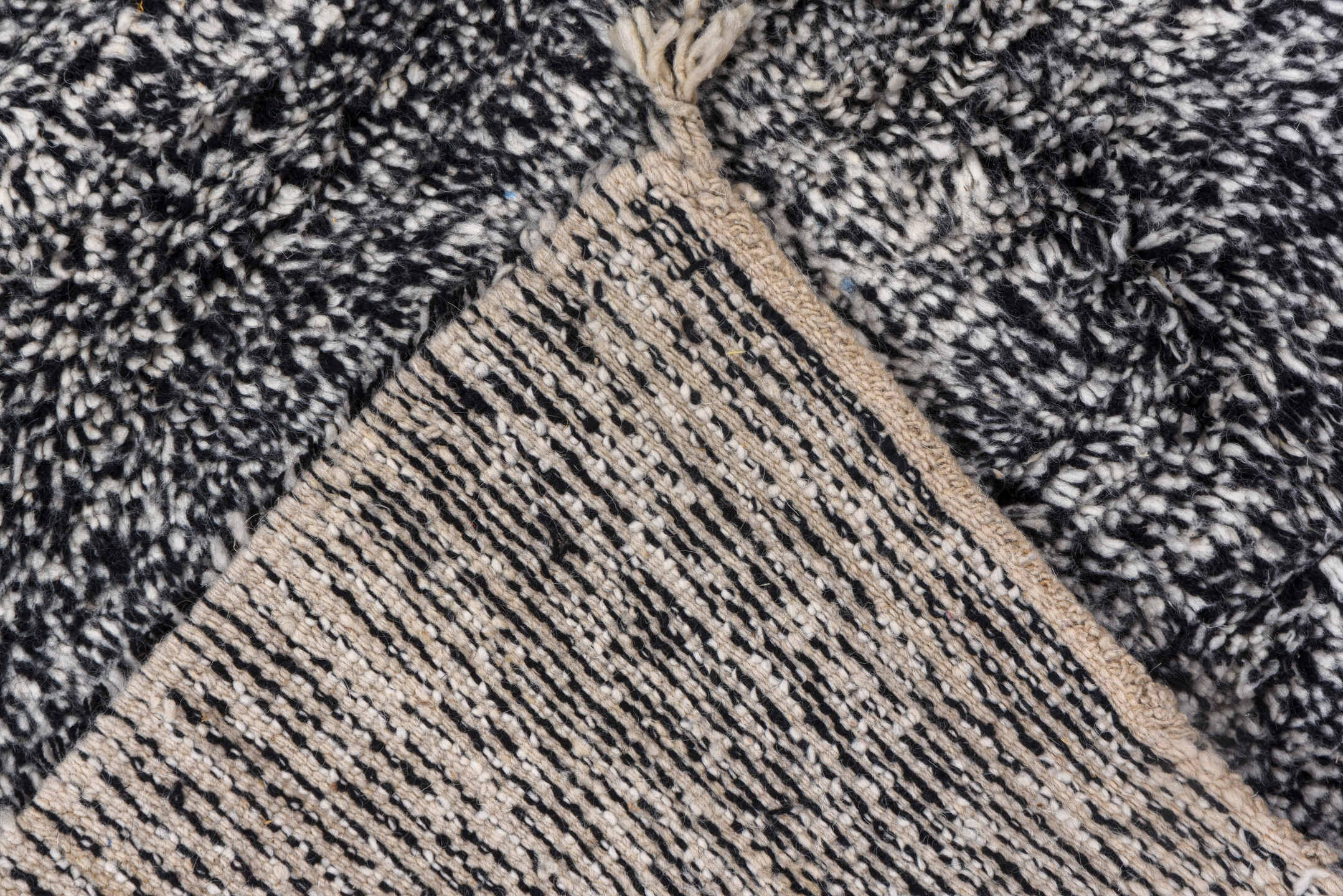 5' x 7' one-of-a-kind handmade vintage Moroccan rug. Color palette: charcoal, ivory, black, cream, gray
