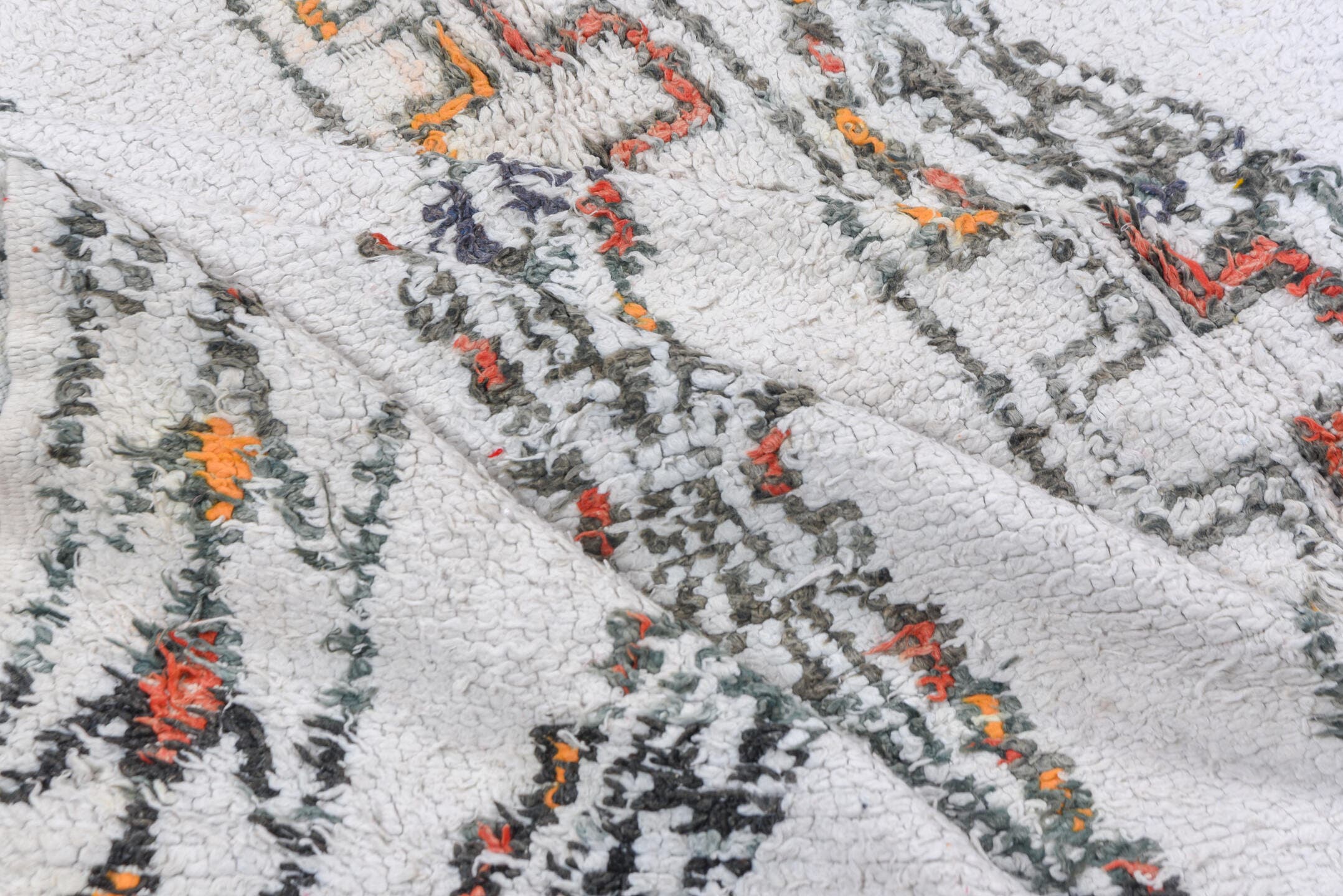5' x 8' one-of-a-kind handmade vintage Moroccan medium size rug. Color palette: ivory, charcoal, rust, saffron, gray, black