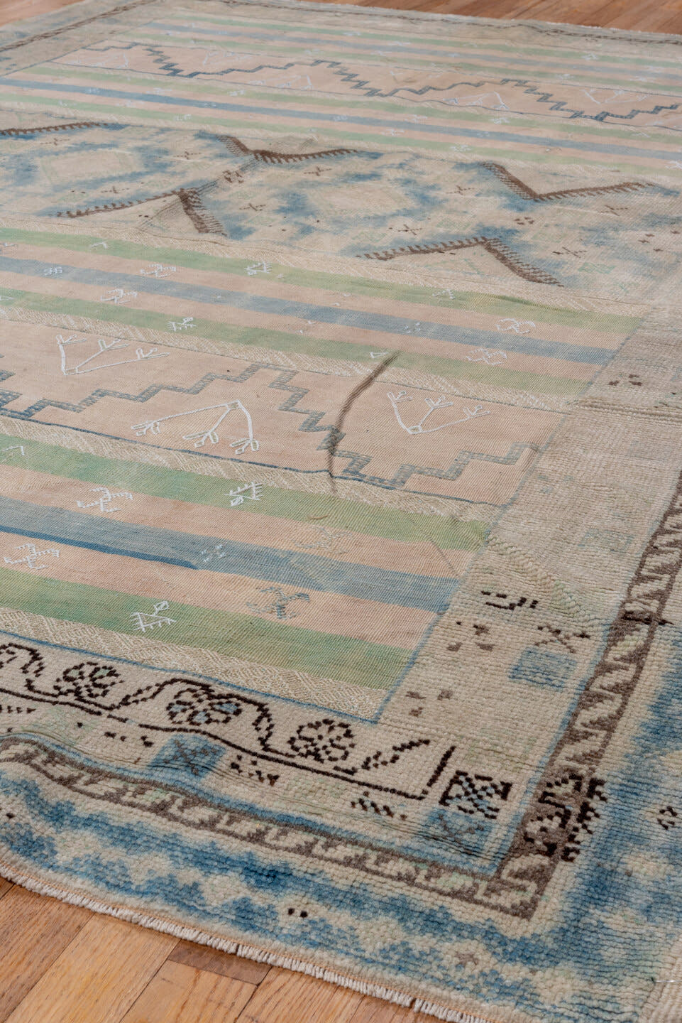 6' x 9' one-of-a-kind handmade antique Moroccan medium size rug. Color palette: ivory, pale blue, sage, blush, taupe, brown