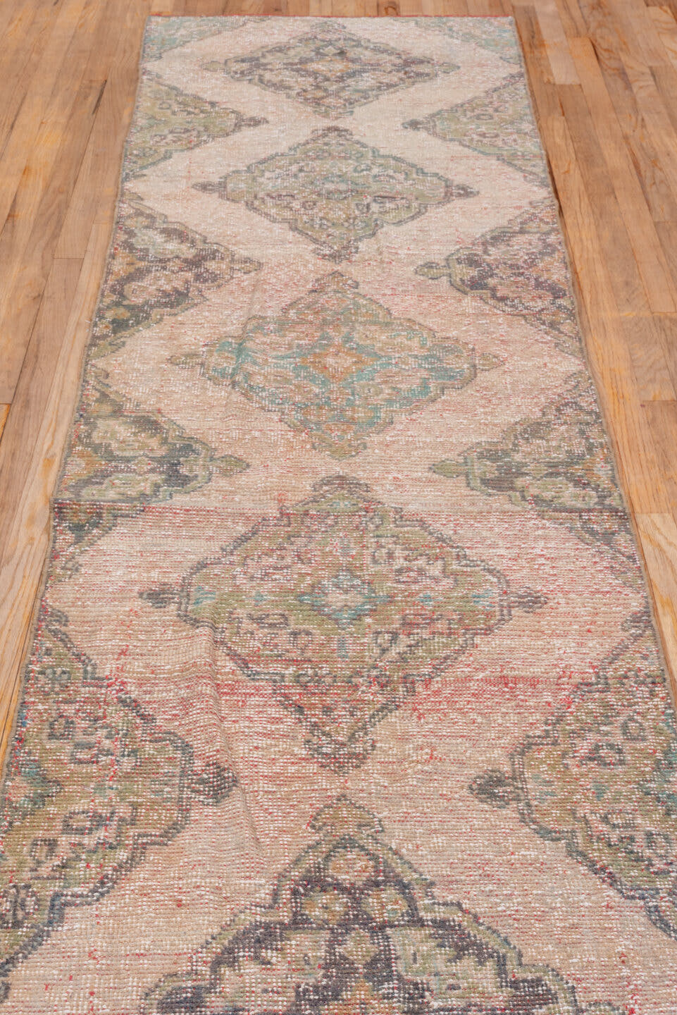 2' x 10' one-of-a-kind handmade antique Oushak runner rug. Color palette: blush, taupe, brown, sage, ivory, rose, olive