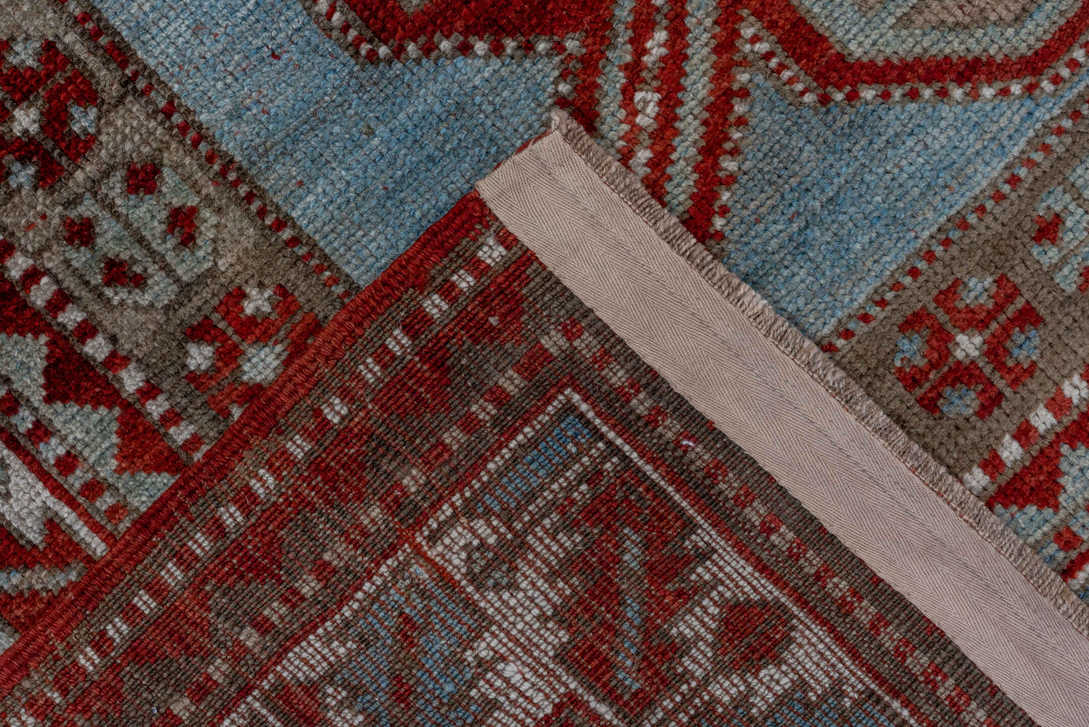 4' x 7' one-of-a-kind handmade antique Kazak rug. Color palette: rust, ivory, sky blue, taupe, brick, camel, terracotta