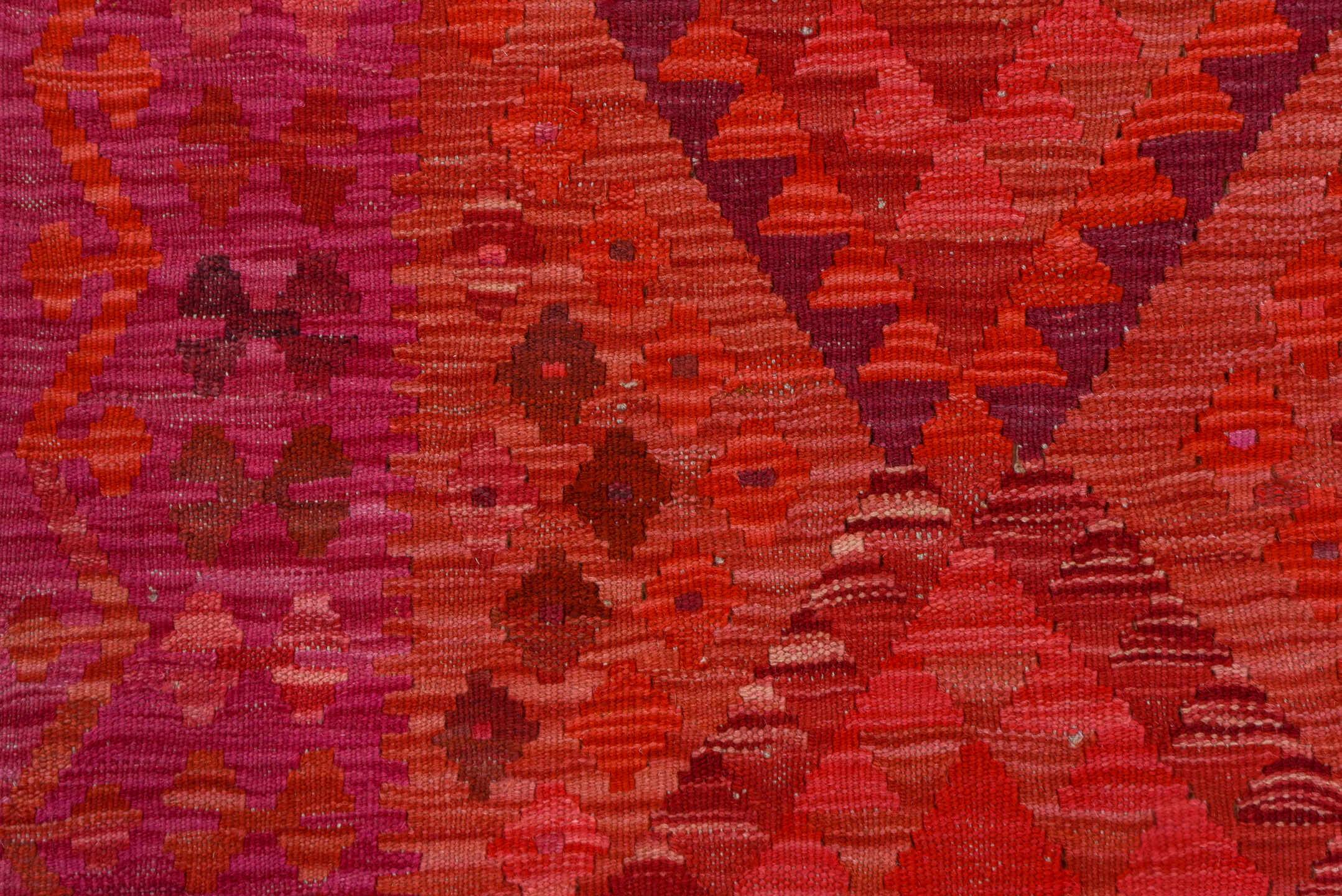 5' x 8' one-of-a-kind handmade vintage Kilim medium size rug. Color palette: magenta, crimson, fuchsia, rose, burgundy