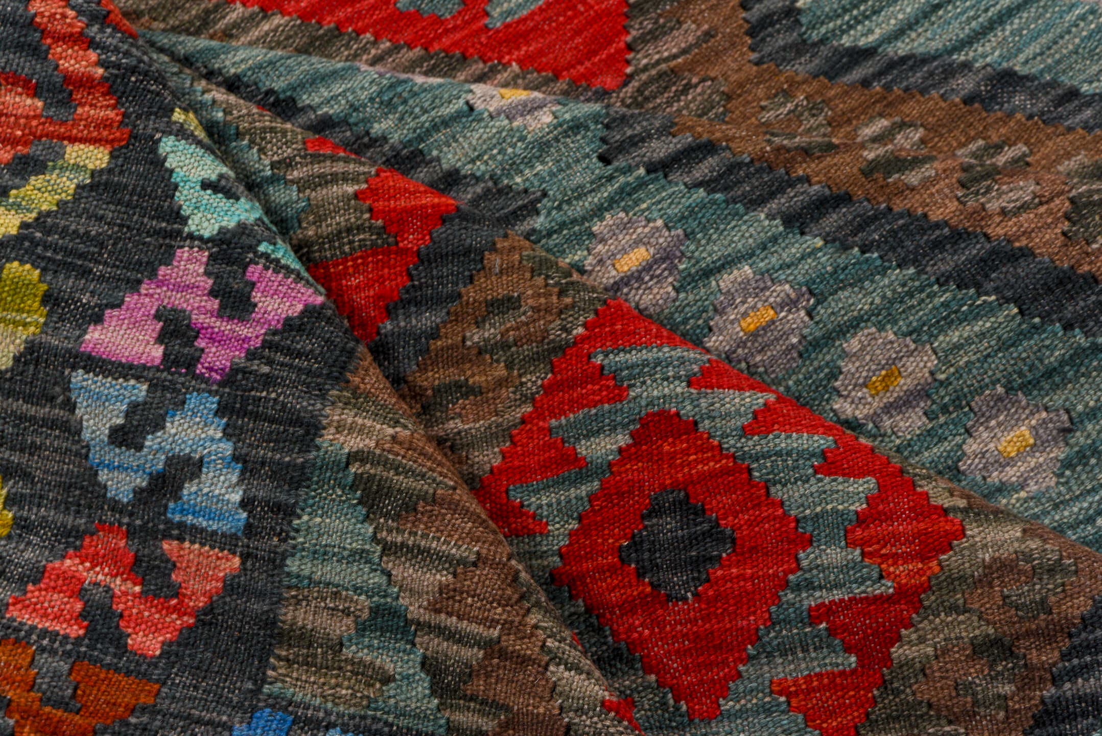 7' x 9' one-of-a-kind handmade vintage Kilim rug. Color palette: aqua, charcoal, crimson, taupe, coral, lavender, ivory
