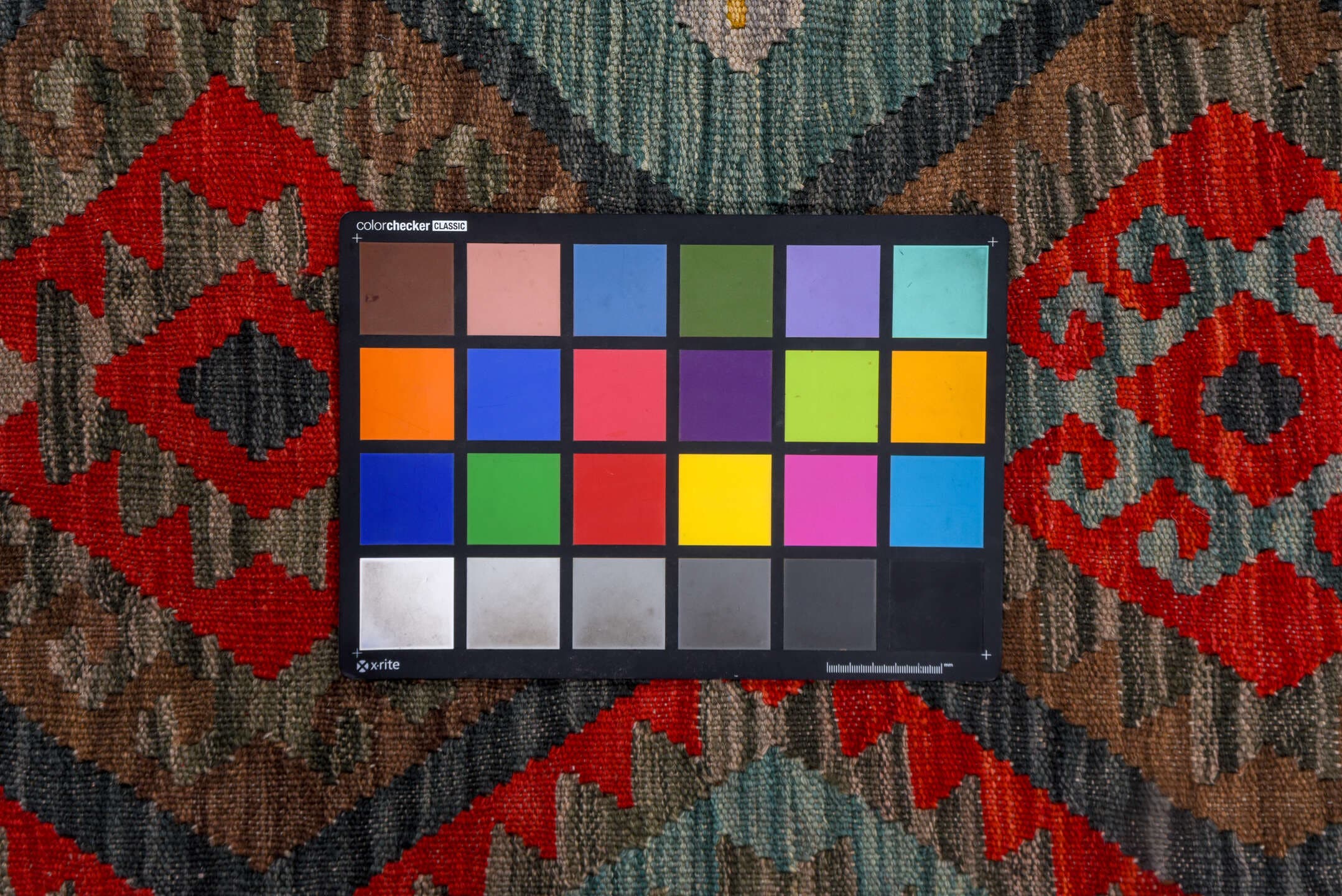 7' x 9' one-of-a-kind handmade vintage Kilim rug. Color palette: aqua, charcoal, crimson, taupe, coral, lavender, ivory