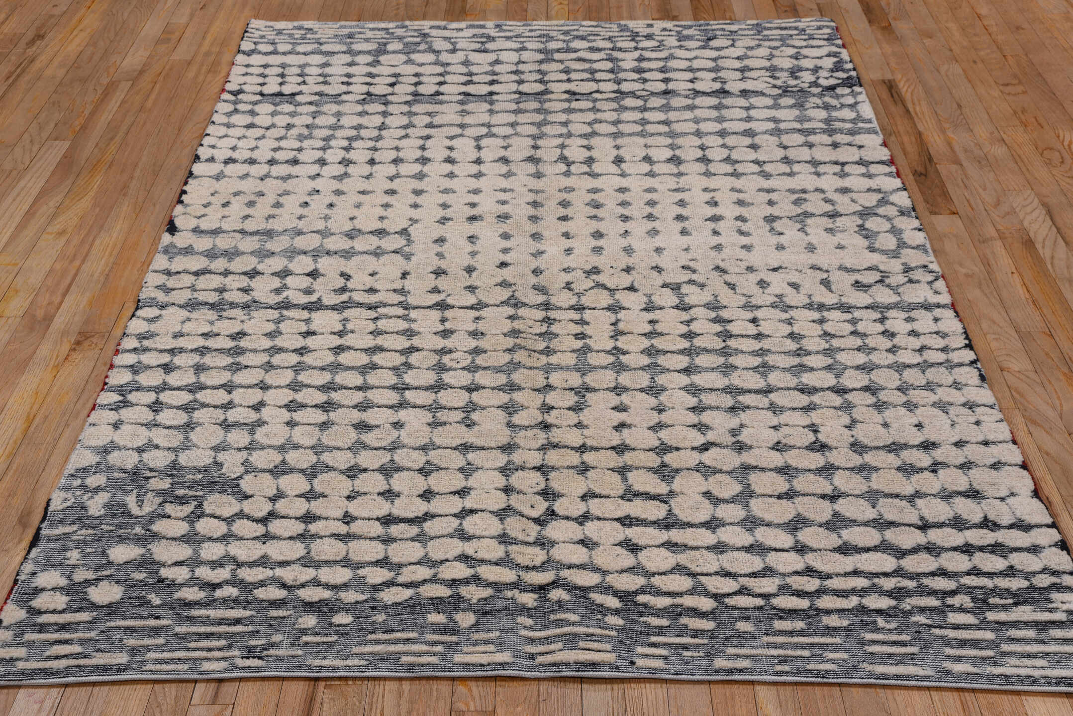 5' x 8' one-of-a-kind handmade handmade Modern medium size rug. Color palette: ivory, slate, gray, charcoal, black