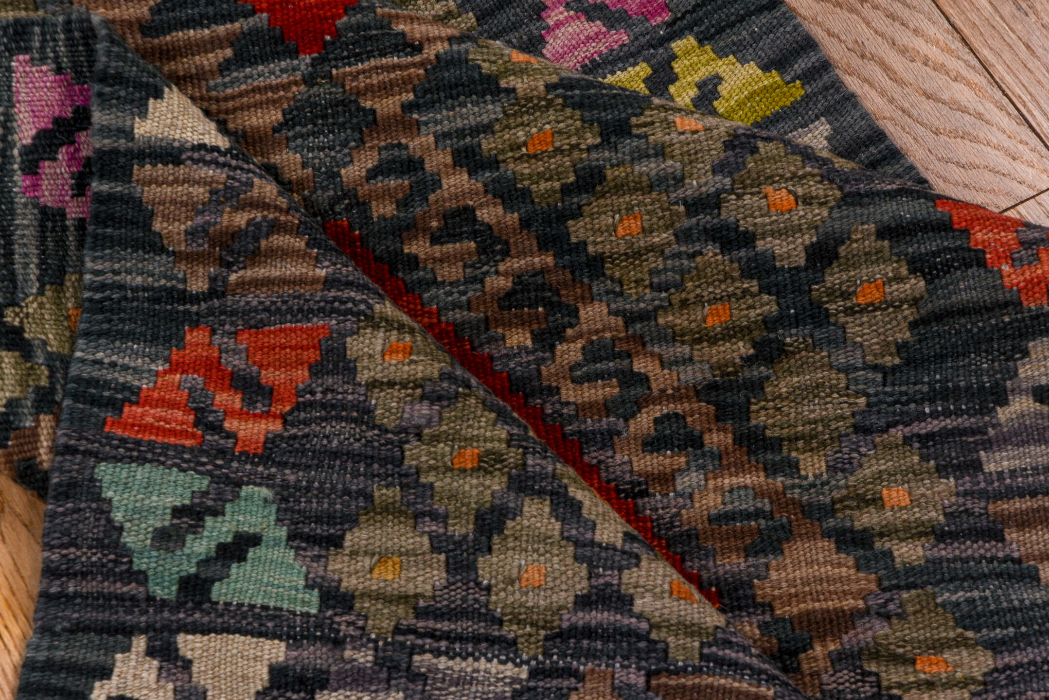 2' x 9' one-of-a-kind handmade vintage Kilim runner rug. Color palette: black, blue, brown, gray, pink, red